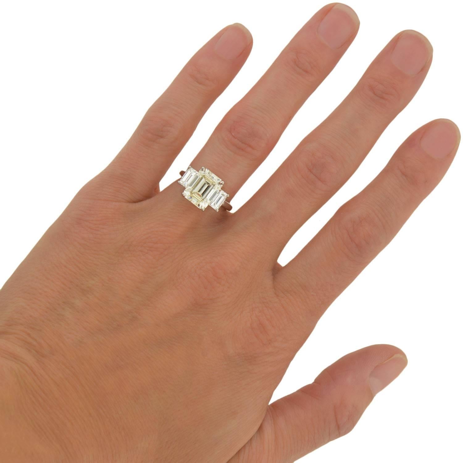 Contemporary 4.13 Carat Emerald Cut Diamond Platinum 3 Stone Engagement Ring  4