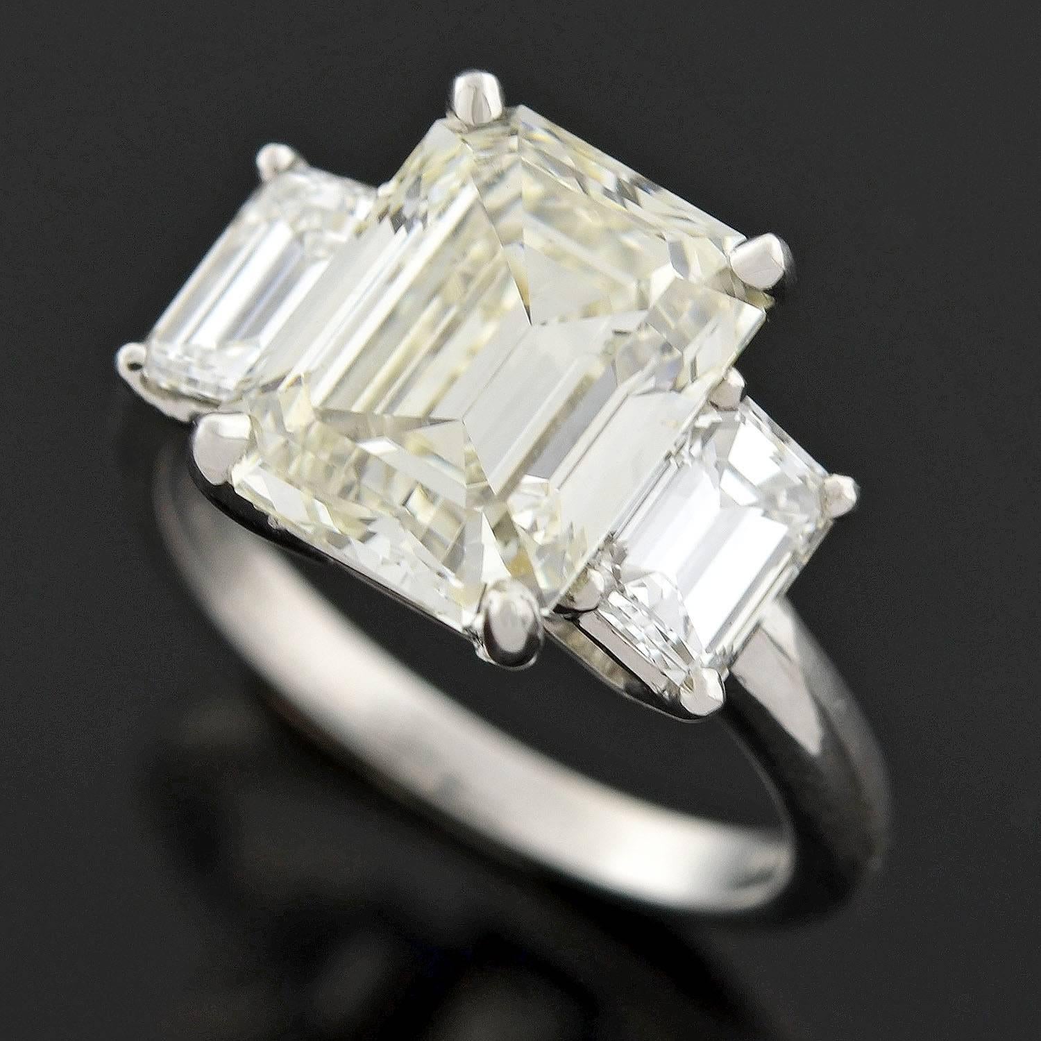 Contemporary 4.13 Carat Emerald Cut Diamond Platinum 3 Stone Engagement Ring  1