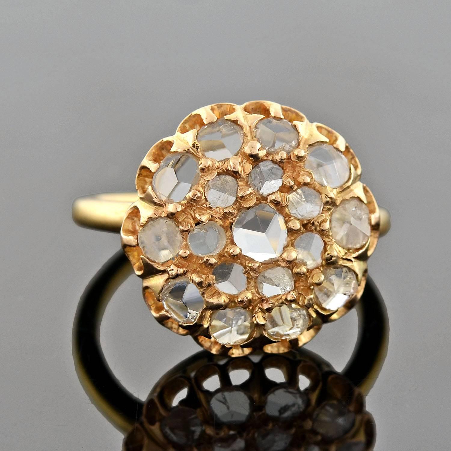 A spectacular rose cut diamond ring from the late Victorian (ca1900) era! This incredible ring features a beautiful cluster of sparkling old Rose Cut diamonds resting in a circular 18kt gold setting. The diamonds vary in size and are hand set in two