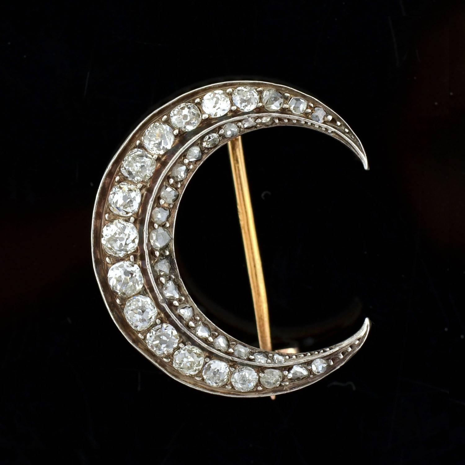 This diamond crescent from the Victorian era (ca1887) is truly stunning! Made of silver-topped 18kt gold, the piece is French in origin and depicts a beautiful crescent moon. The surface is completely encrusted with three dozen sparkling diamonds,