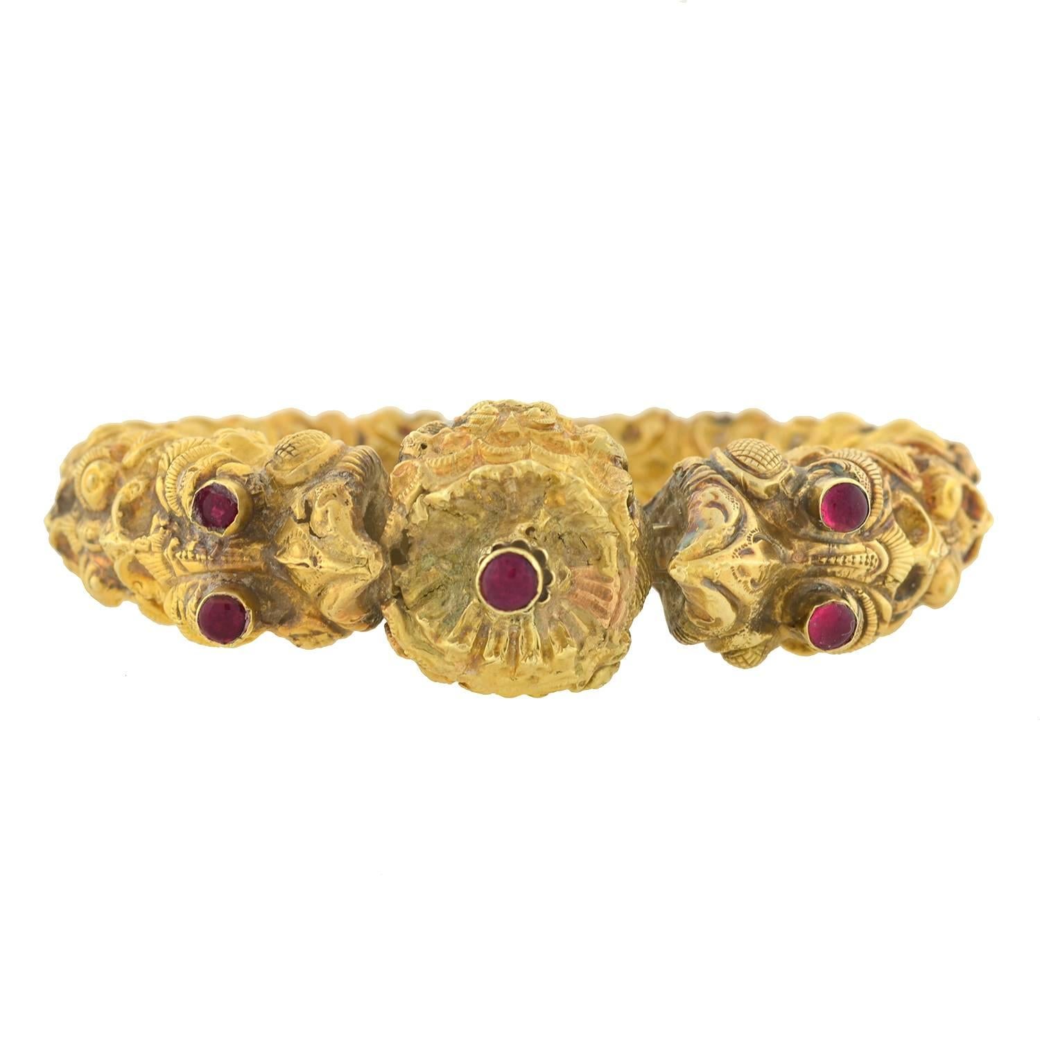 A rare and magnificent Indian bracelet from the Early Victorian (ca1850) era! The bracelet is remarkably substantial, both in size and appearance. Handcrafted in 18kt yellow gold, it has a mythological bird motif, which is richly detailed with a