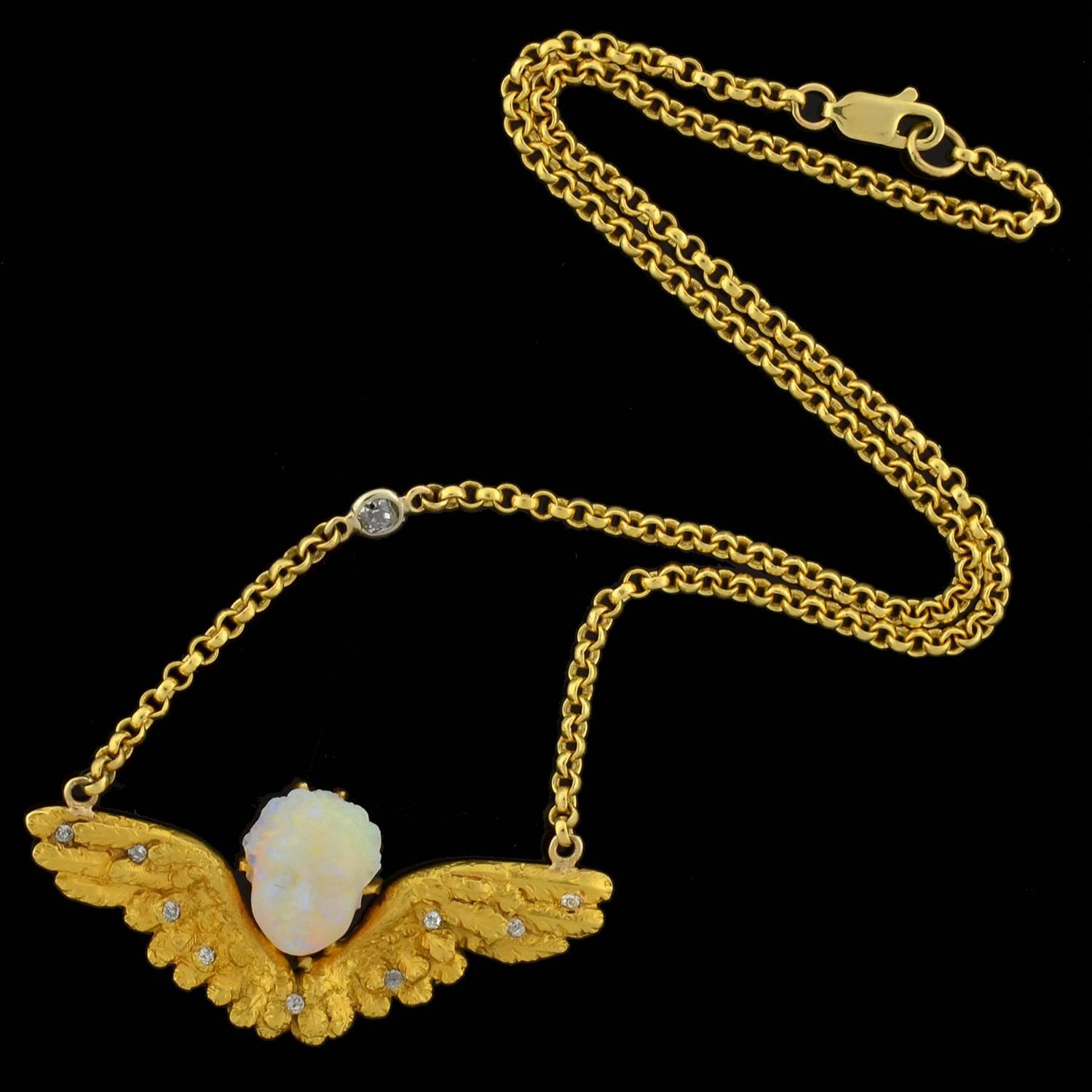 An exquisite handmade necklace from the Victorian (ca1880) era! This stunning piece was originally an antique pin, and is now a beautiful and stylish conversion piece. The necklace is made of 18kt yellow gold, and features a lovely cherub pendant