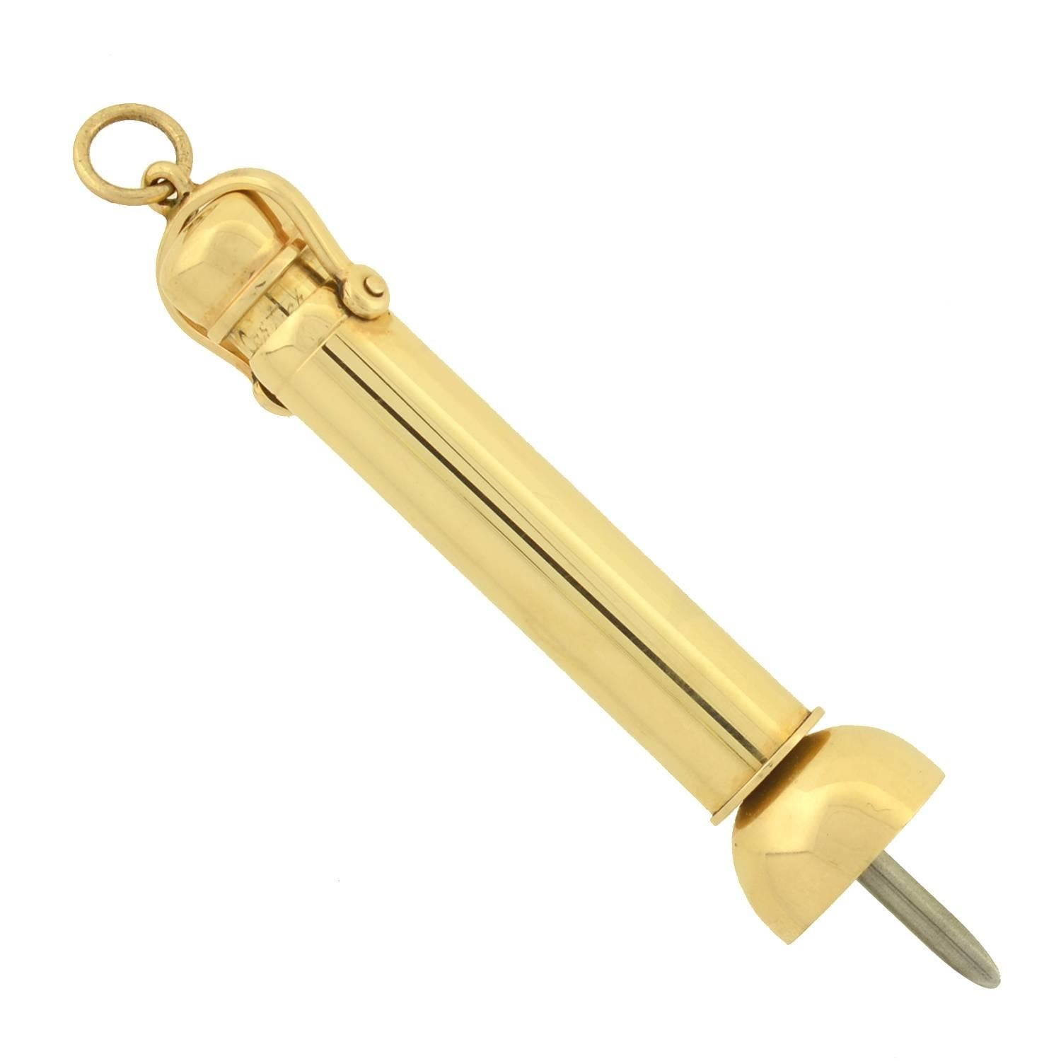 This stylish gold cigar punch from the Art Deco era (ca1930s) is a signed piece by Cartier! Made of solid 14kt gold, the piece is a functioning cigar punch, which would originally have been worn as a fob hanging from a gentleman's watch chain. The