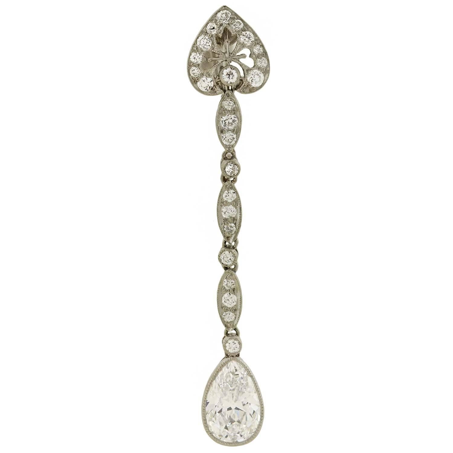 An exquisite and elegant pair of diamond drop earrings from legendary maker Tiffany & Co. These fantastic earrings, which are from the Art Deco (ca1920) era, are crafted in platinum and have a beautiful design encrusted with sparkling diamond