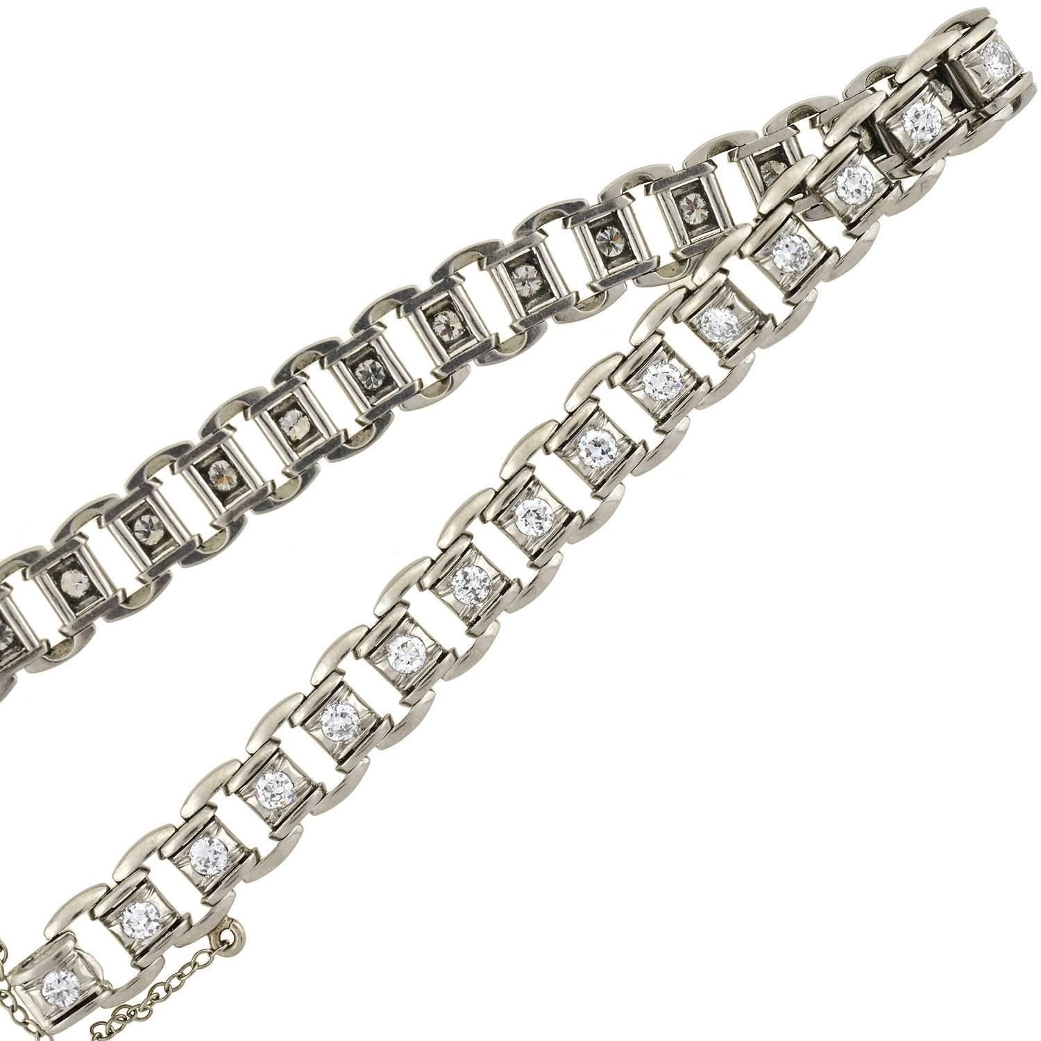 A lovely link bracelet from the Art Deco (ca1930s) era! This platinum bracelet is comprised of hinged "tire track" links that form a straight but flexible design. Each individual box link is set with a sparkling old European cut diamond,