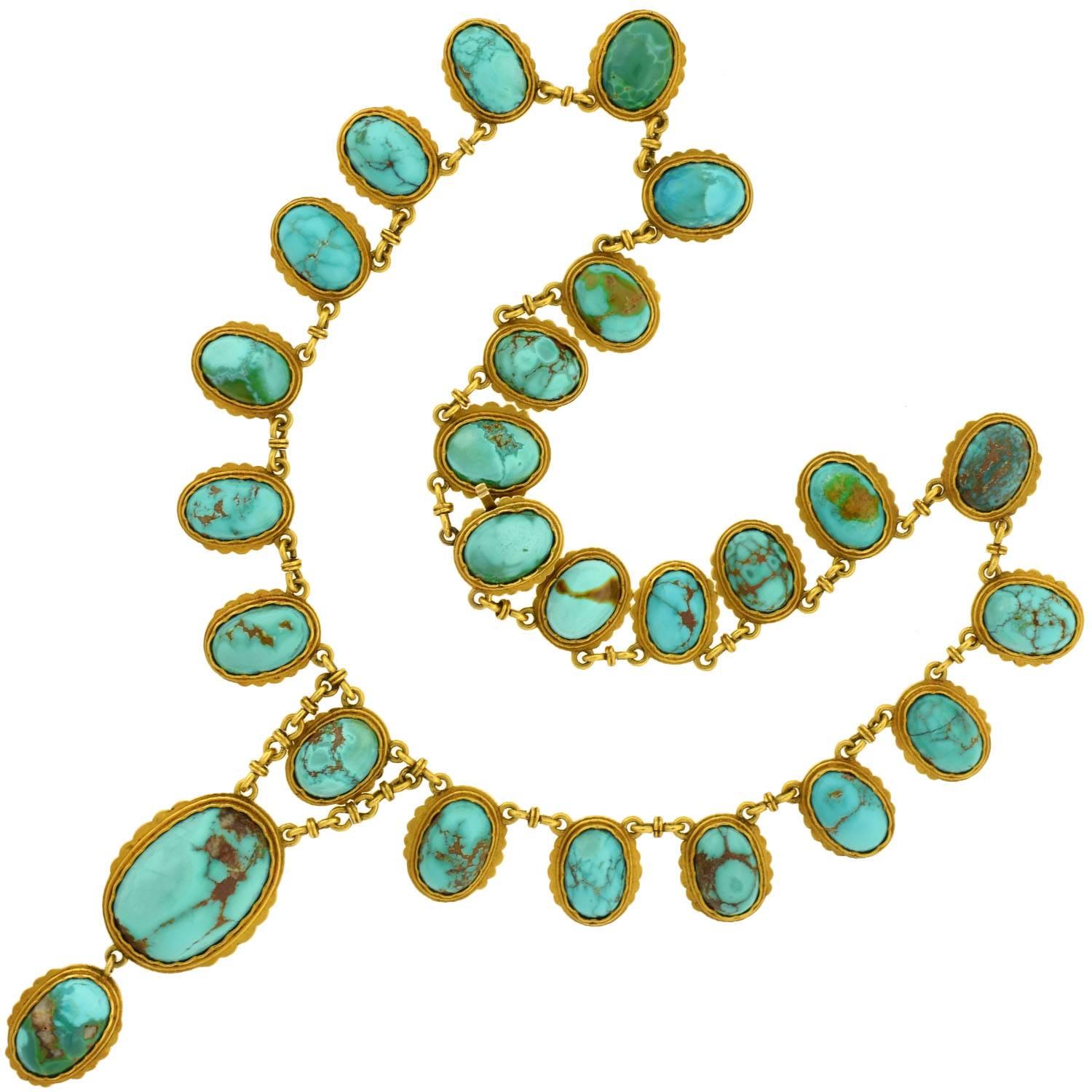 An outstanding turquoise necklace from the Victorian (ca1880) era! This magnificent piece is crafted in 15kt gold (indicating English origin). It features 26 natural turquoise stones that drape along the neckline in a festoon style. Hanging from the