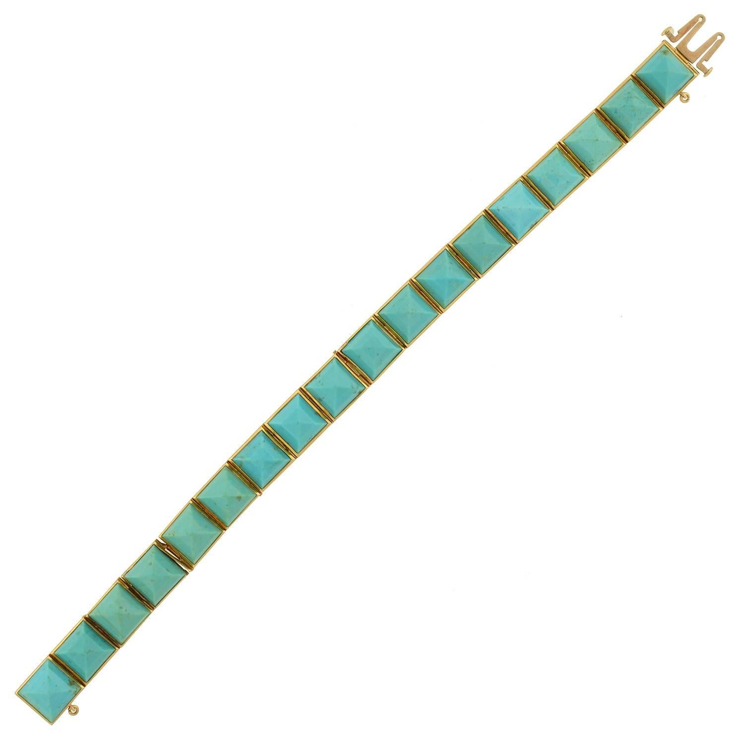 A simply stunning turquoise link bracelet from the Victorian (ca1880) era! Set in 18kt yellow gold, this unusual bracelet is comprised of 18 carved natural turquoise links, which wrap around the entire length of the piece, forming a straight but