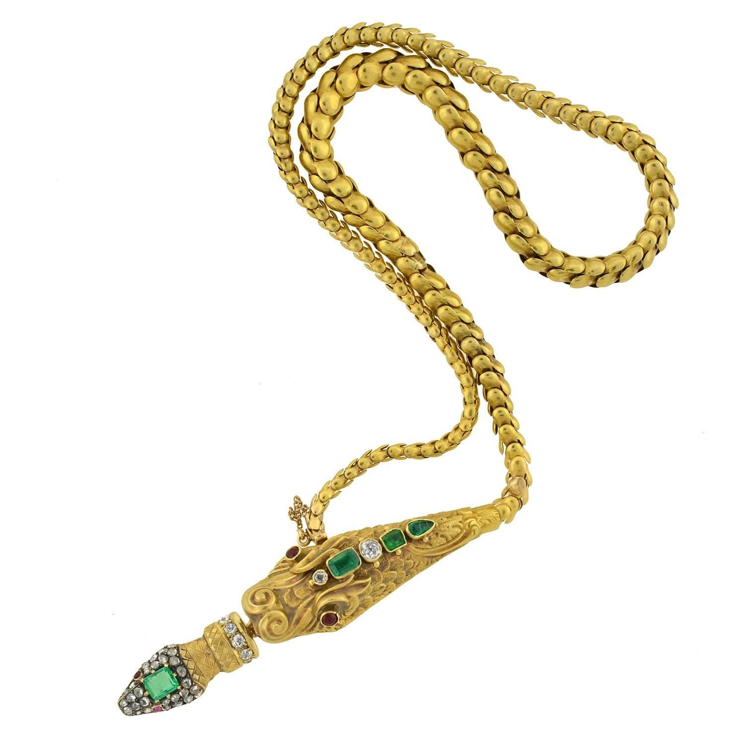 An extraordinary serpentine necklace from the Victorian (ca1880) era! This rare and unusual piece is crafted in 18kt gold and decorated with multiple gemstone accents. An elaborate dragon's head rests at the center, which has an exotic appearance