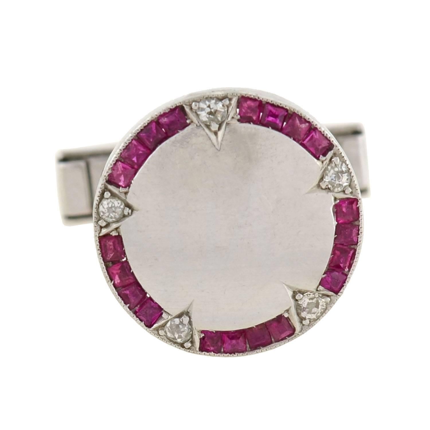 A very striking pair of cufflinks from the late Art Deco era (ca1930) era! Made of platinum and 14kt white gold, these attractive cufflinks are beautifully accented with vibrant rubies and diamonds. The platinum cufflink faces, which are round in