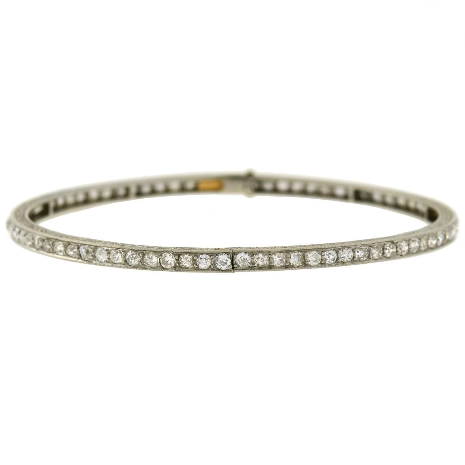 A beautiful diamond bracelet from the Edwardian (ca1910) era! This stunning piece is crafted in platinum, and lined with sparkling mine cut diamonds. The pavé setting creates a continuous glittering row of stones, which weigh approximately 5.00ctw
