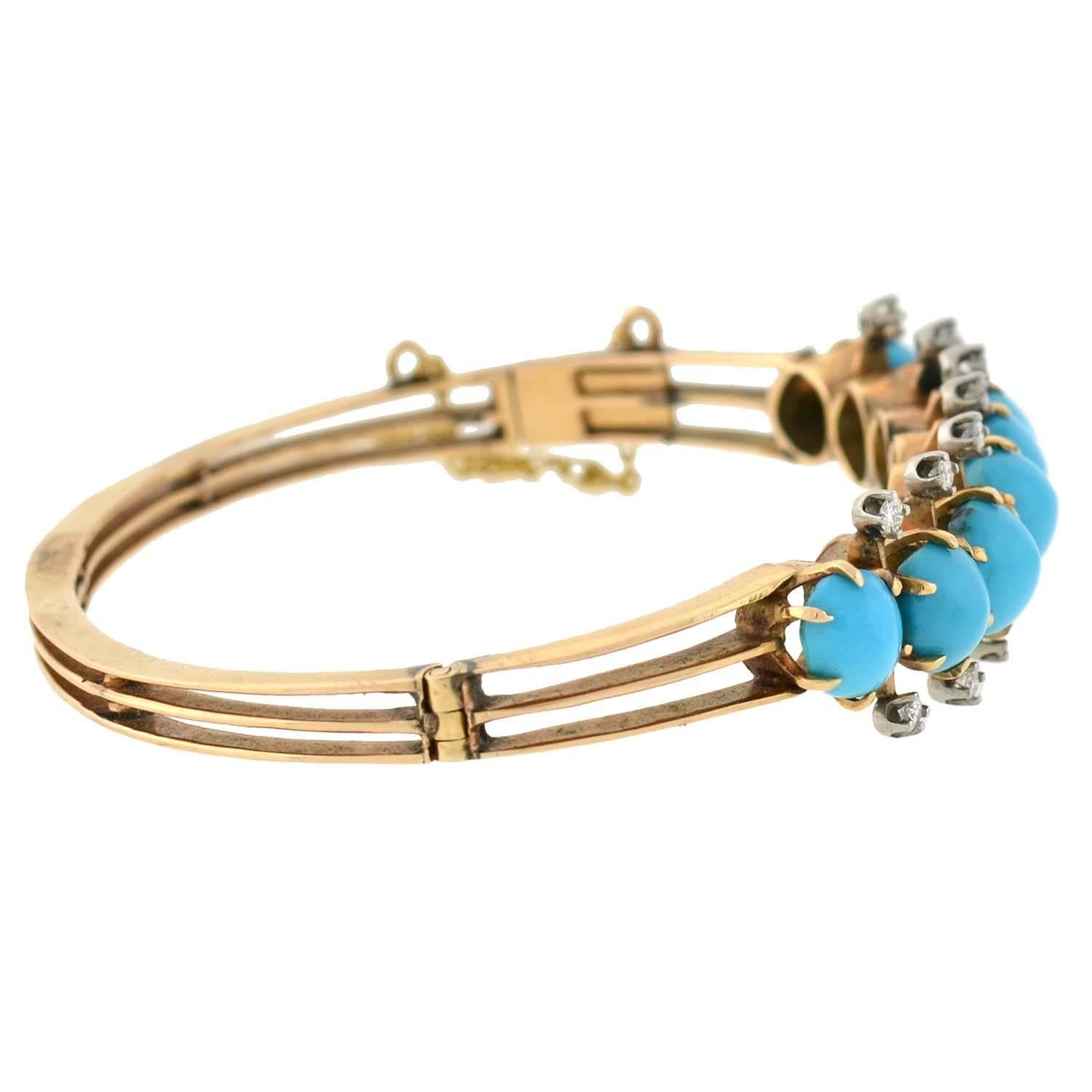 An absolutely gorgeous gold bangle bracelet from the Victorian (ca1880) era! This beautiful piece is made of 14kt yellow gold and is detailed with a row of 8 vibrant Persian turquoise stones set along the front. Resting above and below in between