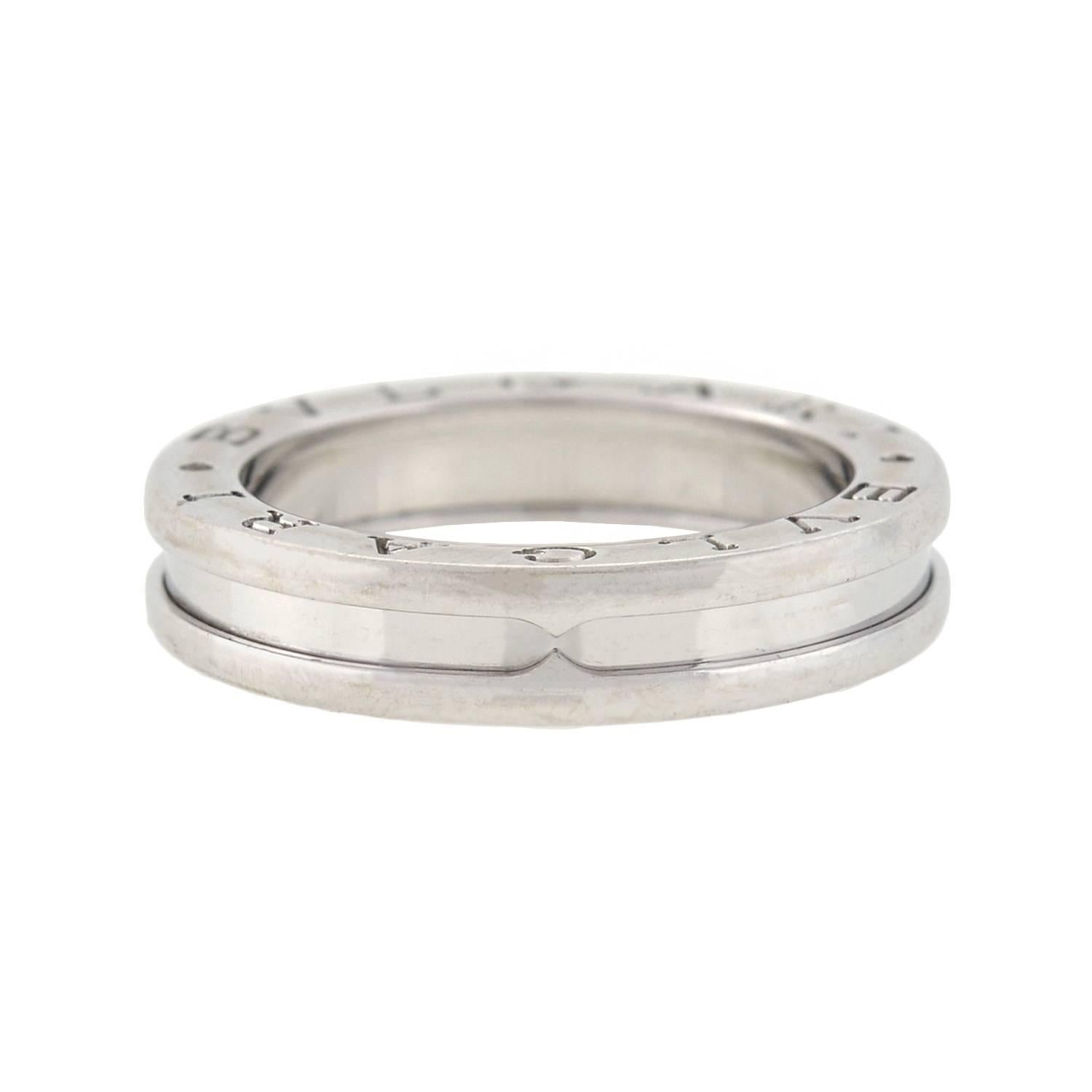 Known as the "B.ZERO 1" single band, this fabulous gold ring is a signed piece by legendary maker Bvlgari! Made of 18kt white gold, the ring has a layered design with a smooth band center that is capped on either side. The outer 'layered