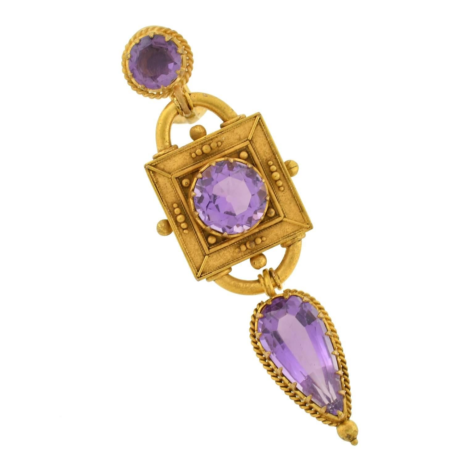 Fantastic amethyst earrings from the Victorian (ca1880) era! These gorgeous earrings are made of rich 18kt yellow gold and feature an exquisite architectural design. Each begins with an amethyst stone which is prong set and framed by a twisted rope