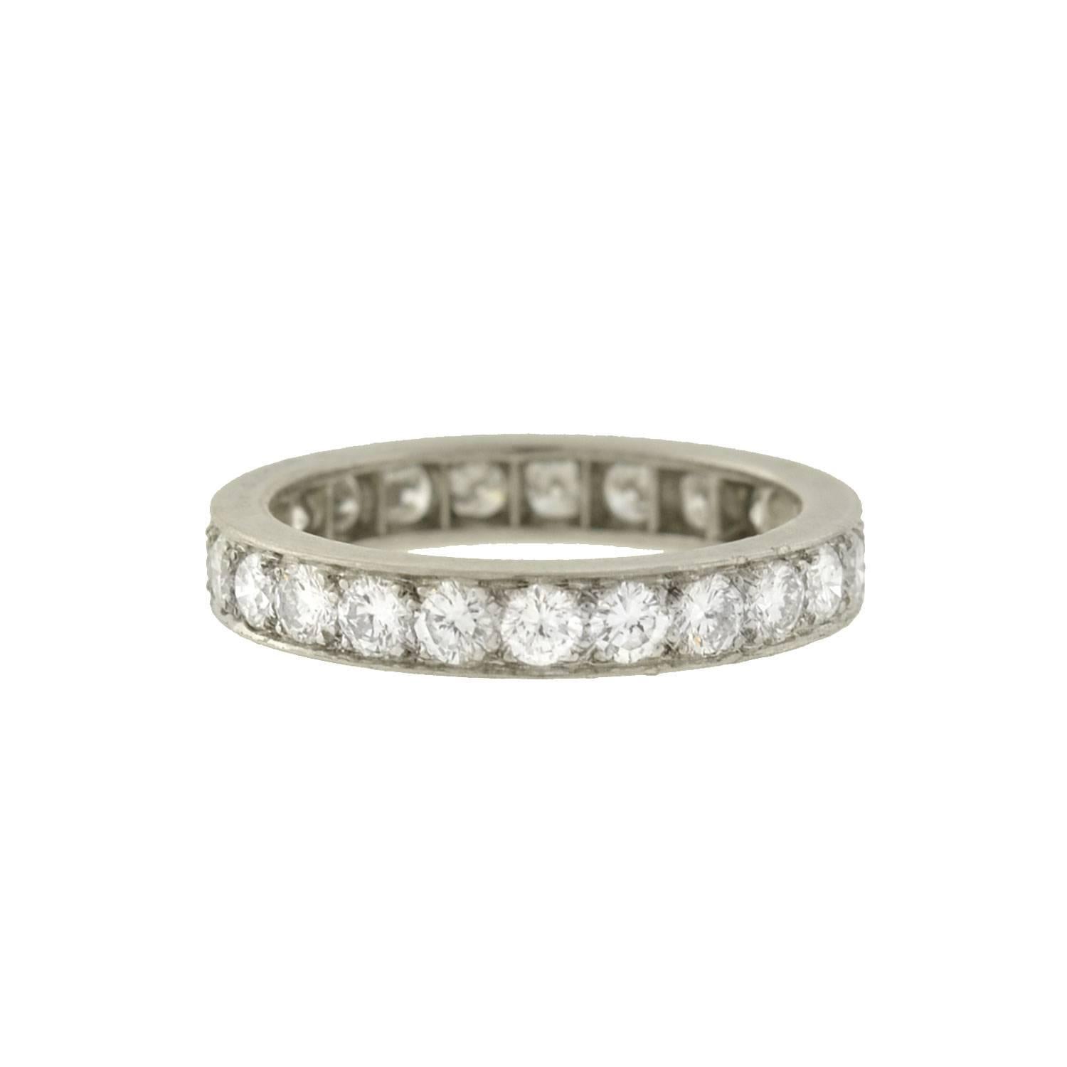 A gorgeous diamond eternity band from the Art Deco (ca1920) era! This beautiful ring is crafted in platinum, and has a design that is both elegant and timeless. A row of old European Cut diamonds carry seamlessly around the band's surface, sparkling