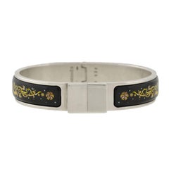 Hermes Black and Yellow Enameled Clic Clac Bracelet