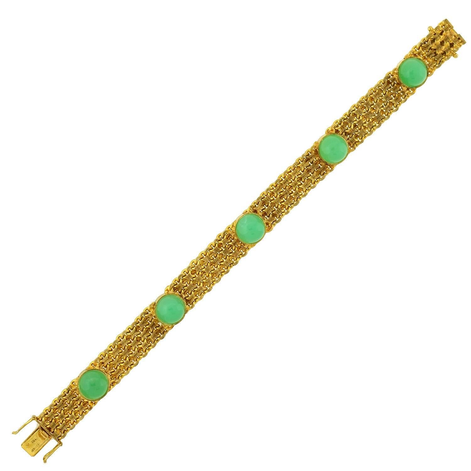 A fabulous vintage bracelet from the 1960s! This stylish piece is crafted in vibrant 14kt gold, forming a flexible line bracelet. A series of interlocking links create a stylish chainmail base, which wraps comfortably around the wrist. Lining the