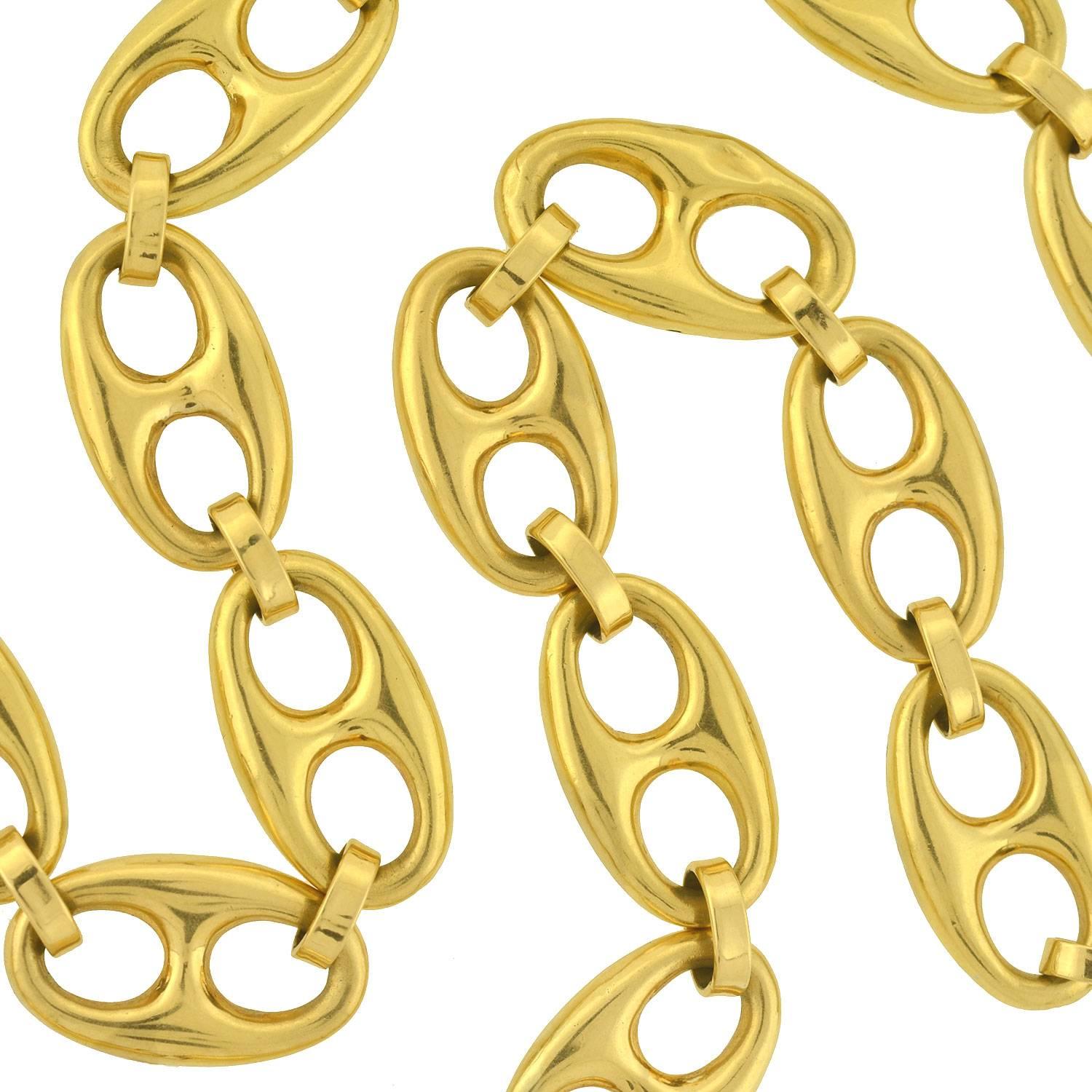 This stylish estate necklace has a classic anchor link design! This substantial necklace is made of solid 18kt gold, and is comprised of large anchor links (also called "mariner links") that alternate with loop connectors, forming a