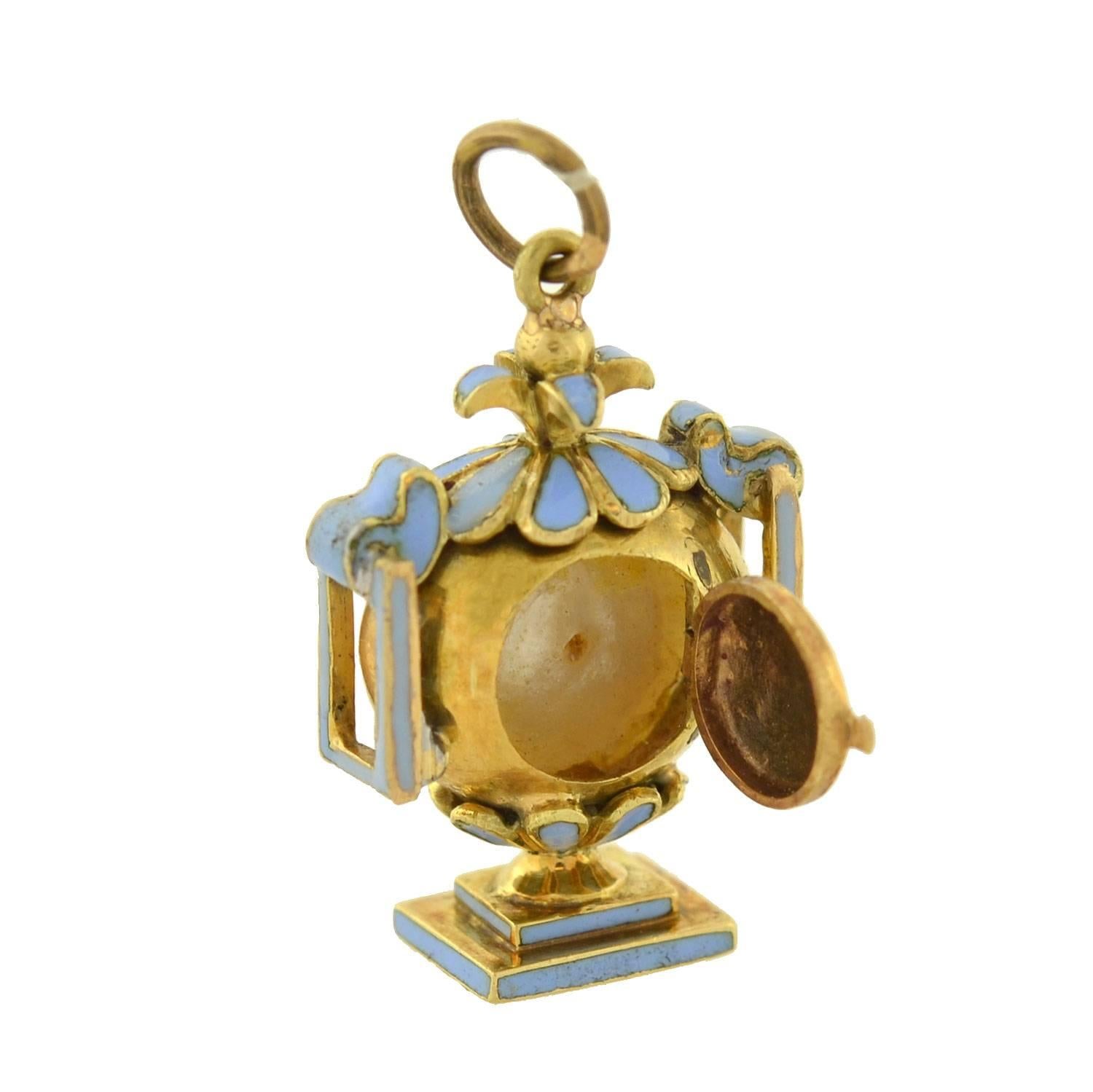 This rare memorial urn pendant from the Victorian era (ca1880) is quite an unusual piece! Crafted in 18kt gold, the pendant is richly detailed, and serves as a fine example of the mourning jewelry tradition. A natural white pearl portrays the