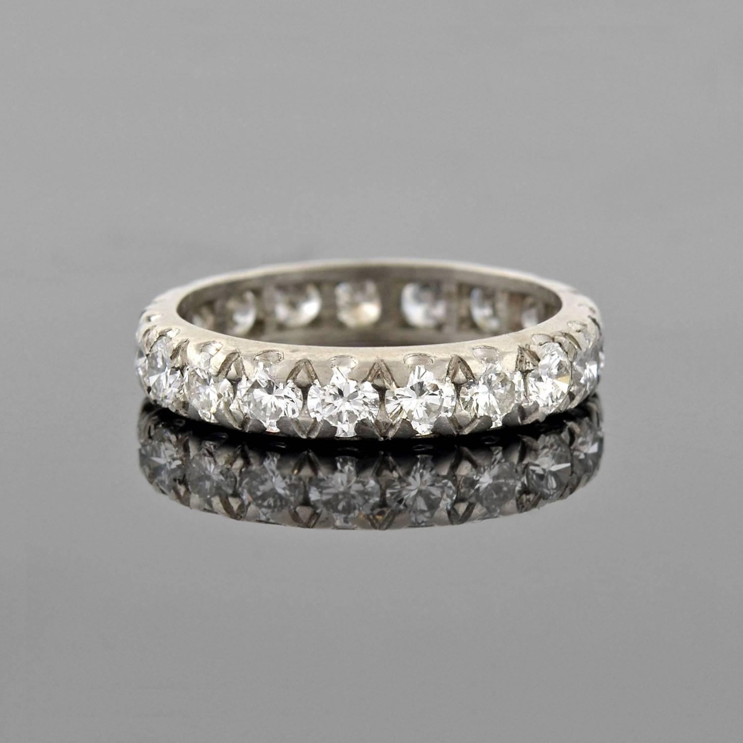 This diamond eternity band from the Retro era (ca1940s) is a real beauty! Made of platinum, the band is comprised of round brilliant diamonds that have a collective carat weight of approximately 2.50ctw. The stones rest in a shared prong setting