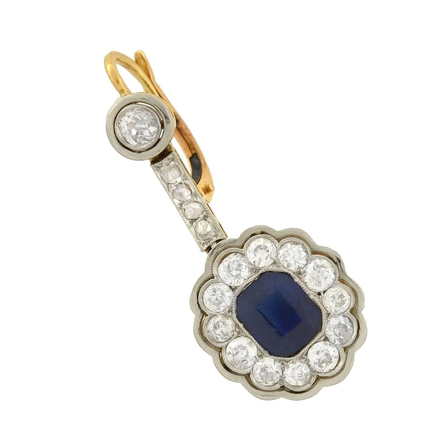 A breathtaking pair of sapphire and diamond earrings from the Edwardian (ca1910) era! These exquisite mixed metals earrings are made of platinum-topped 14kt gold, and have an elegant dangling design. A sapphire and diamond link hangs at the base,