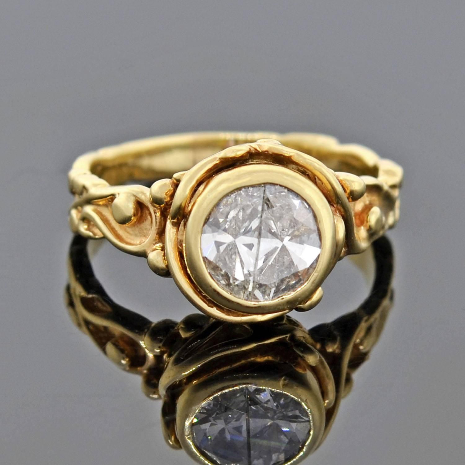 A beautiful and unusual vintage diamond ring from the 1960s! Crafted in 14kt gold, the sculptural setting frames two 