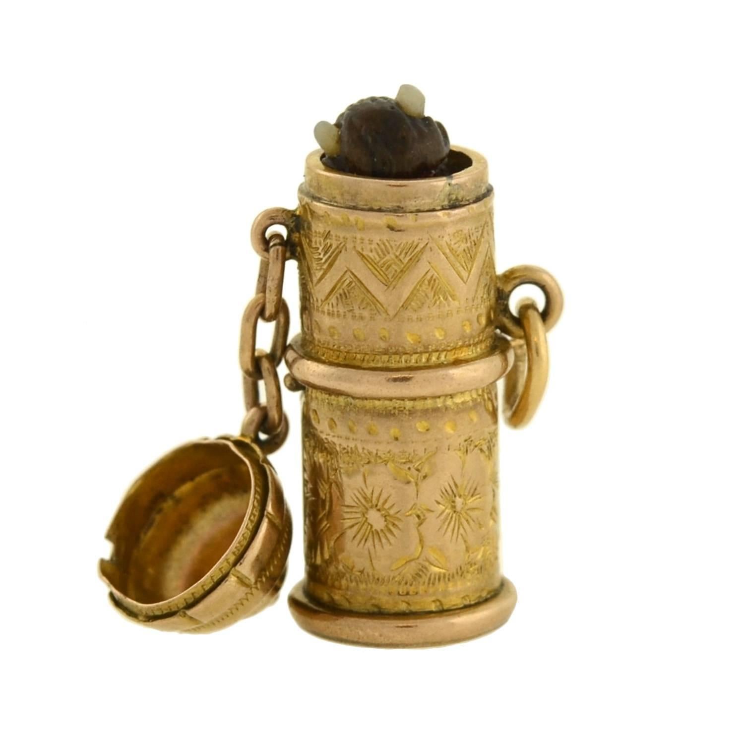 A rare and unusual antique charm from the Victorian (ca1880) era! This collectable piece consists of a 14kt gold capsule, which holds a small devil totem hidden inside. During the Victorian era, many jewelry elements were shrouded in symbolism and