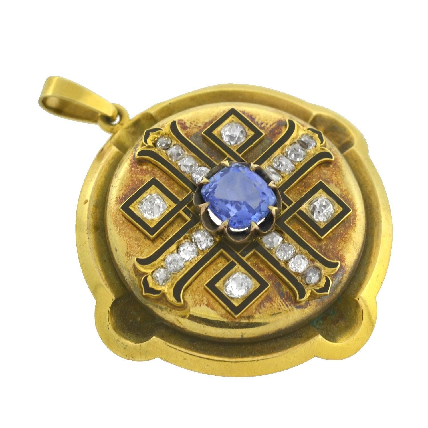 An incredible sapphire and diamond pendant from the Victorian (ca1880) era! This fabulous piece is made of 15kt yellow gold (indicating English origin) and has a brilliant multi stone design on the front surface. The pendant is round and substantial