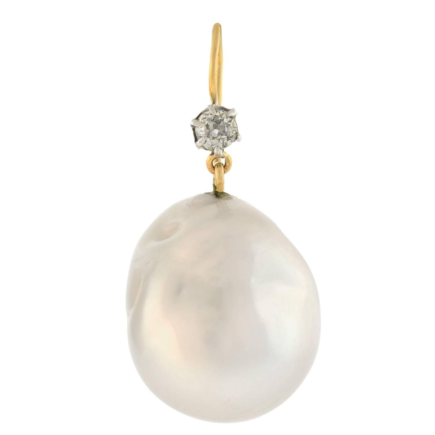 Lovely South Sea pearl earrings from the Late Victorian (ca1900) era! Each of these fabulous earrings is comprised of a single South Sea pearl which hangs from a simple diamond topper. The natural South Sea pearls are quite substantial in size, and
