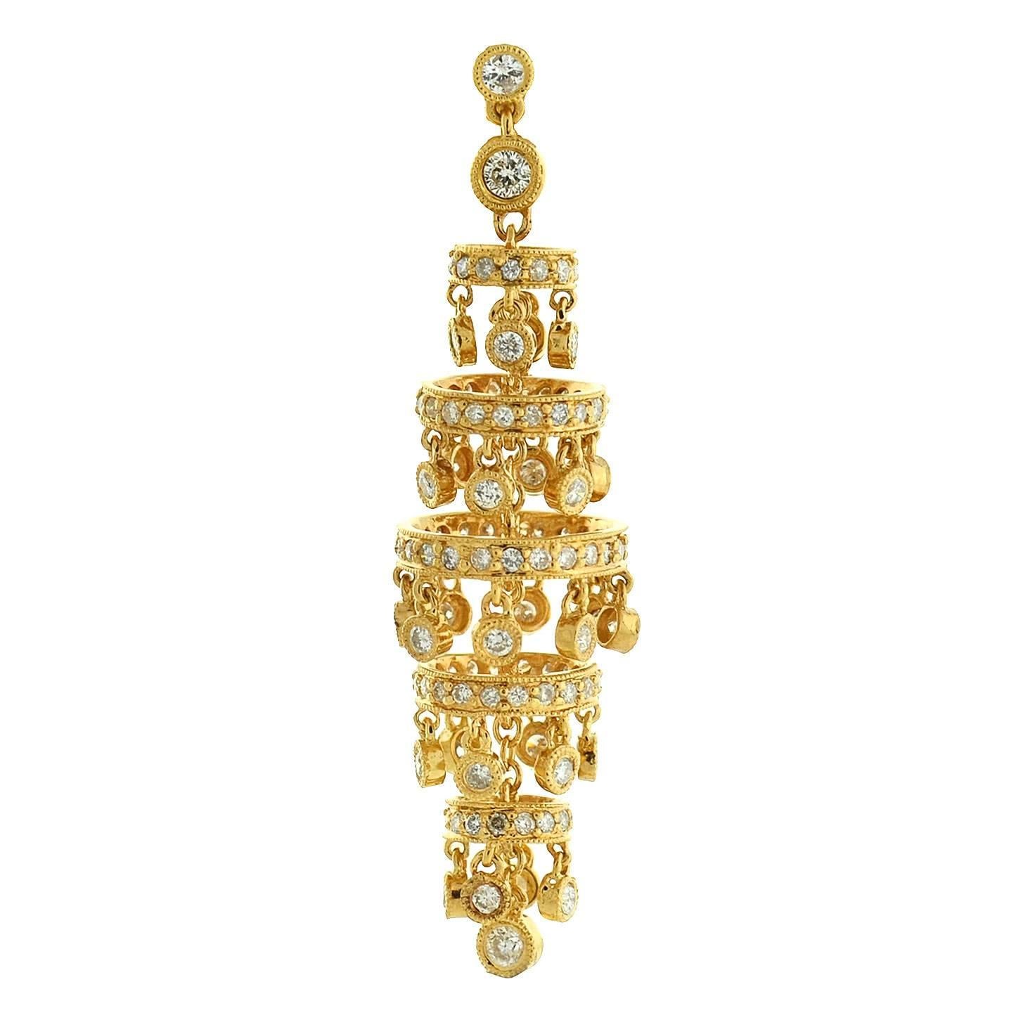 These incredible estate chandelier earrings are nothing short of spectacular! Each earring is crafted in vibrant 18kt gold, and has a dramatic tiered design. The chandelier design is comprised of 5 