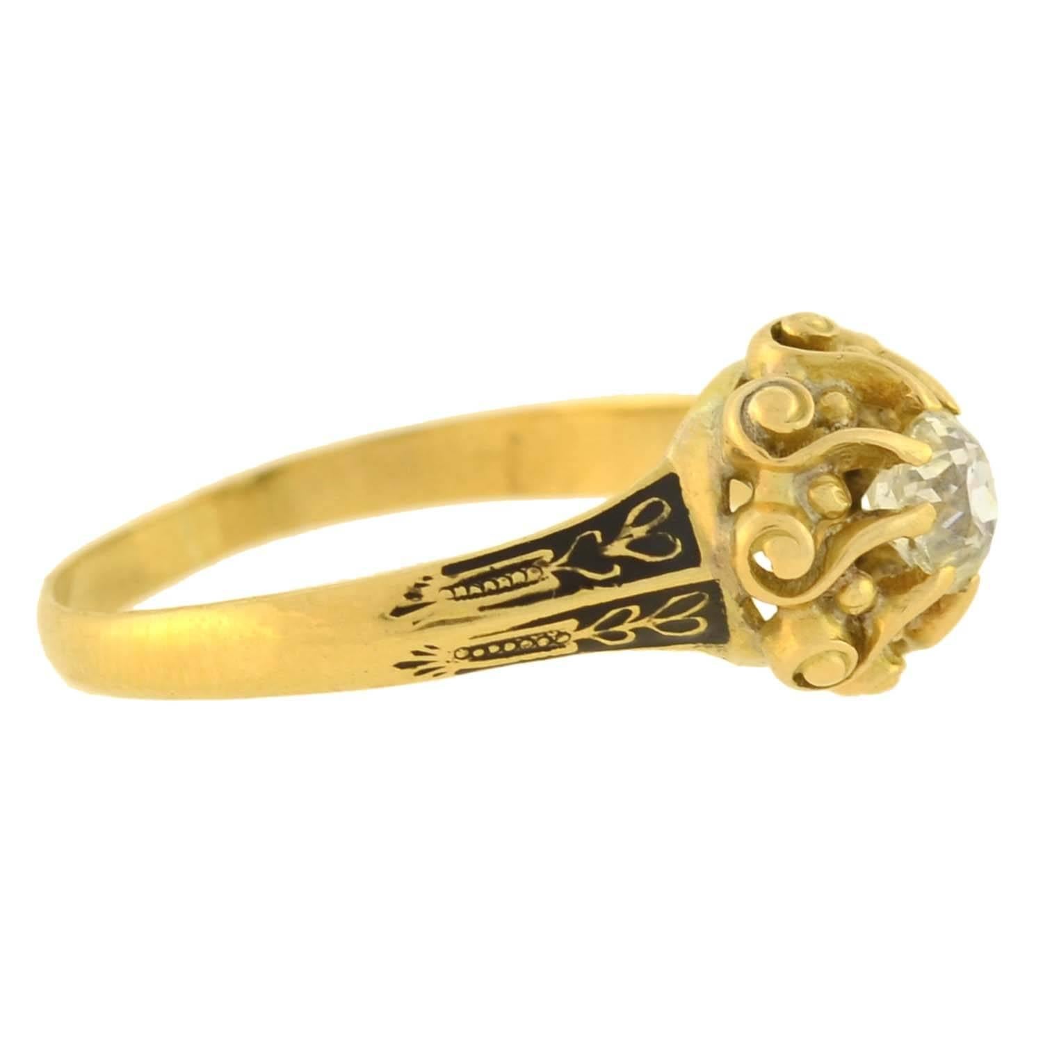 An exquisite diamond ring from the Georgian (ca1830) era! This gorgeous 18kt gold ring features a stunning cushion Mine Cut diamond at the center, which weighs approximately 0.60ct with estimated K color and SI2 clarity. The diamond is prong set