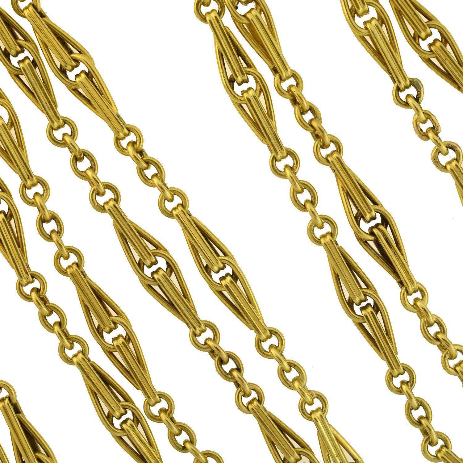 An absolutely exquisite gold chain from the late Victorian (ca1900) era! Extremely generous in length and heavy in weight, the chain is comprised of ornate 18kt yellow gold links, which have a simple and beautiful design. The interlocking elongated