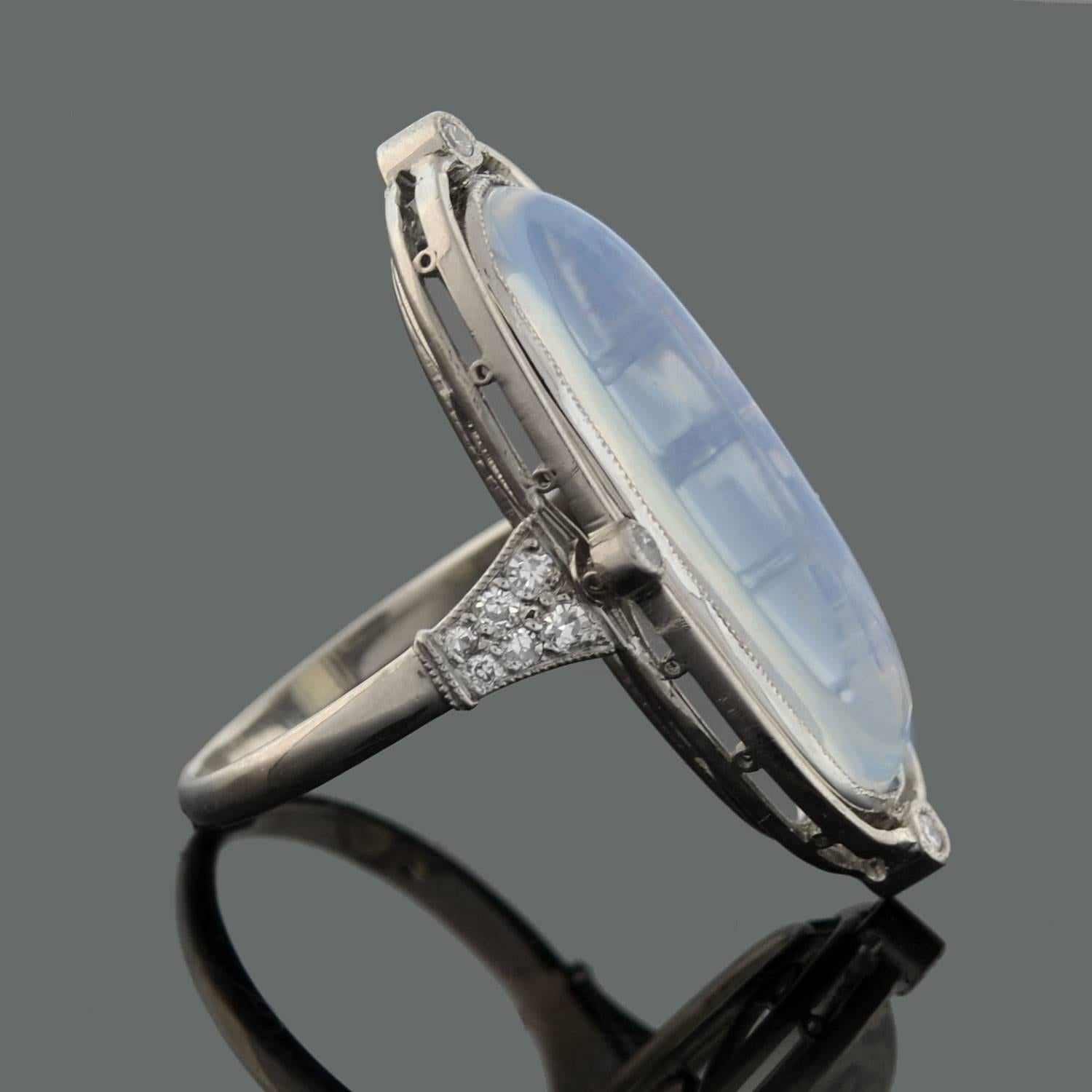 

This outstanding Tiffany & Co. moonstone ring from the Edwardian (ca1910) era is absolutely exquisite! Made of platinum, the ring has an elongated oval shape which features a large cabochon moonstone in the center. The moonstone, which weighs