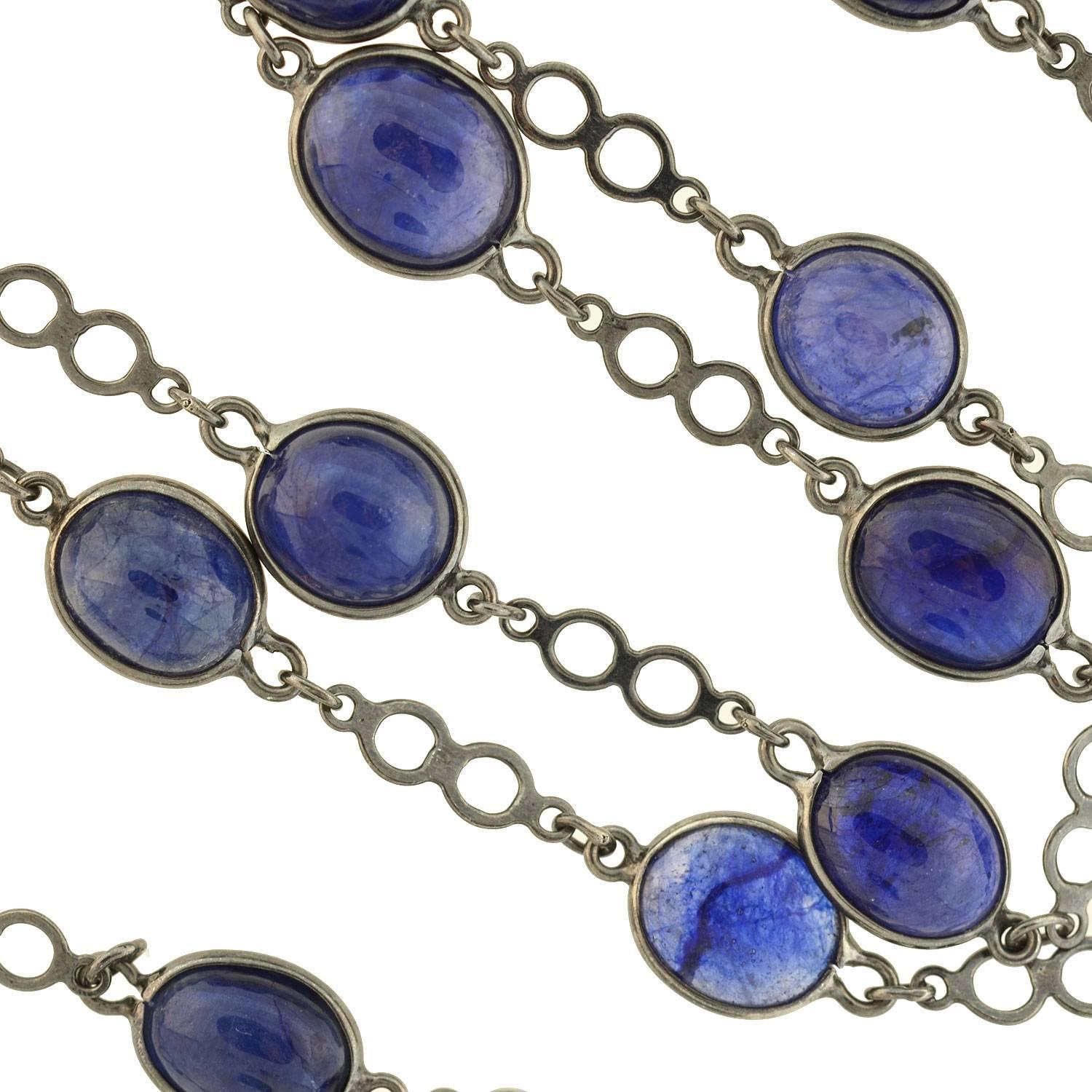 An outstanding Estate necklace with a beautiful look! This fantastic piece is crafted in blackened sterling silver and comprised of 22 mesmerizing sapphire links, each held within an open sterling bezel. The sapphire stones vary slightly in size and