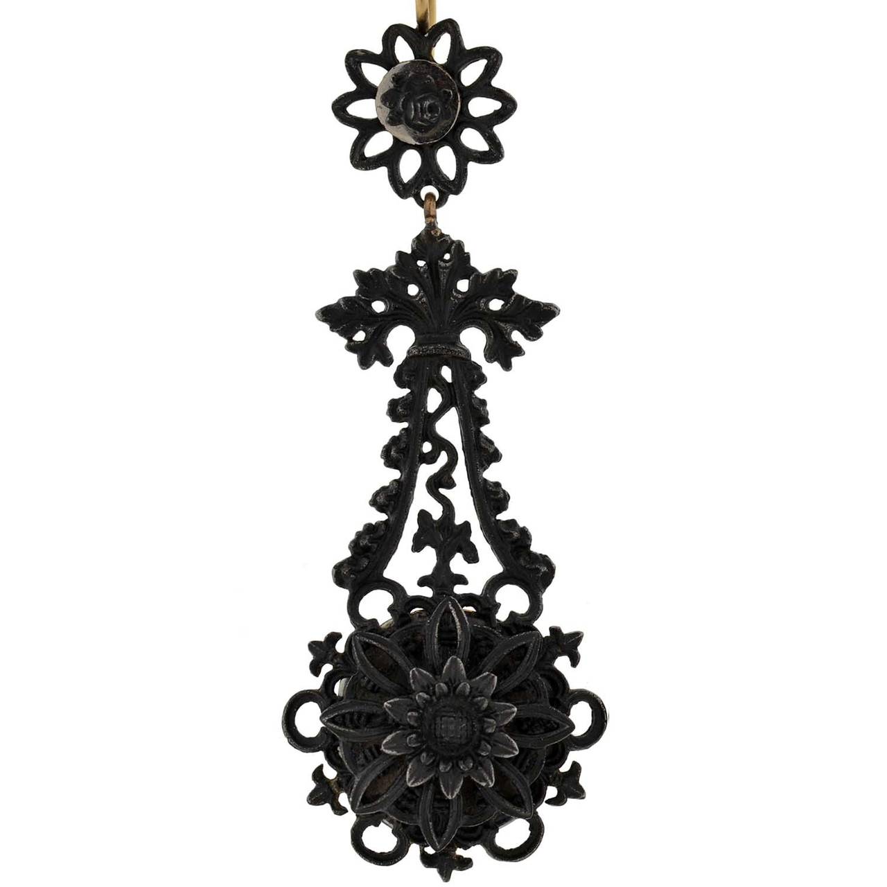 Berlin iron jewelry was produced in Germany by the Berlin Royal Foundry beginning in 1804. Previously, iron jewelry had primarily been worn in periods of mourning due to its dark color. However, it reached a high point of popularity between 1813 and