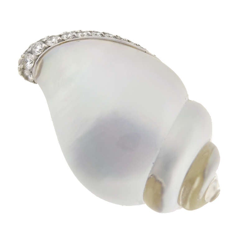 A fantastic pair of Estate earrings signed by Italian maker Vhernier! These wonderful seashell inspired earrings have a detailed and charming design. Each clip-on style earring features a large, smooth conch shell made of carved rock quartz crystal.
