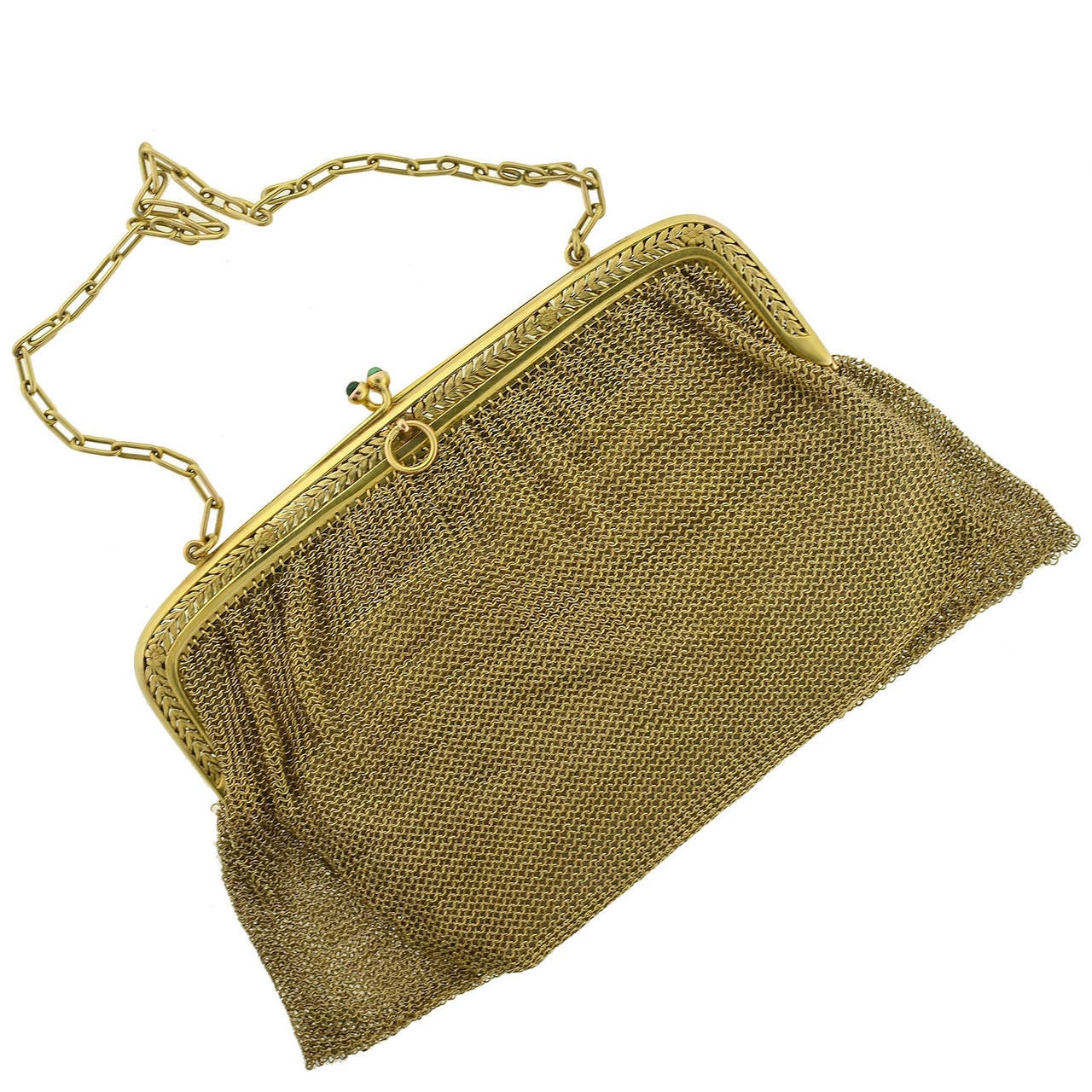 This gold ladies' purse from the Edwardian (ca1910) era is quite a glamorous accessory! The body of the purse is formed by a handcrafted chainmaille design comprised of fine 14kt yellow gold rings, forming a slinky, mesh bag that hangs from a solid