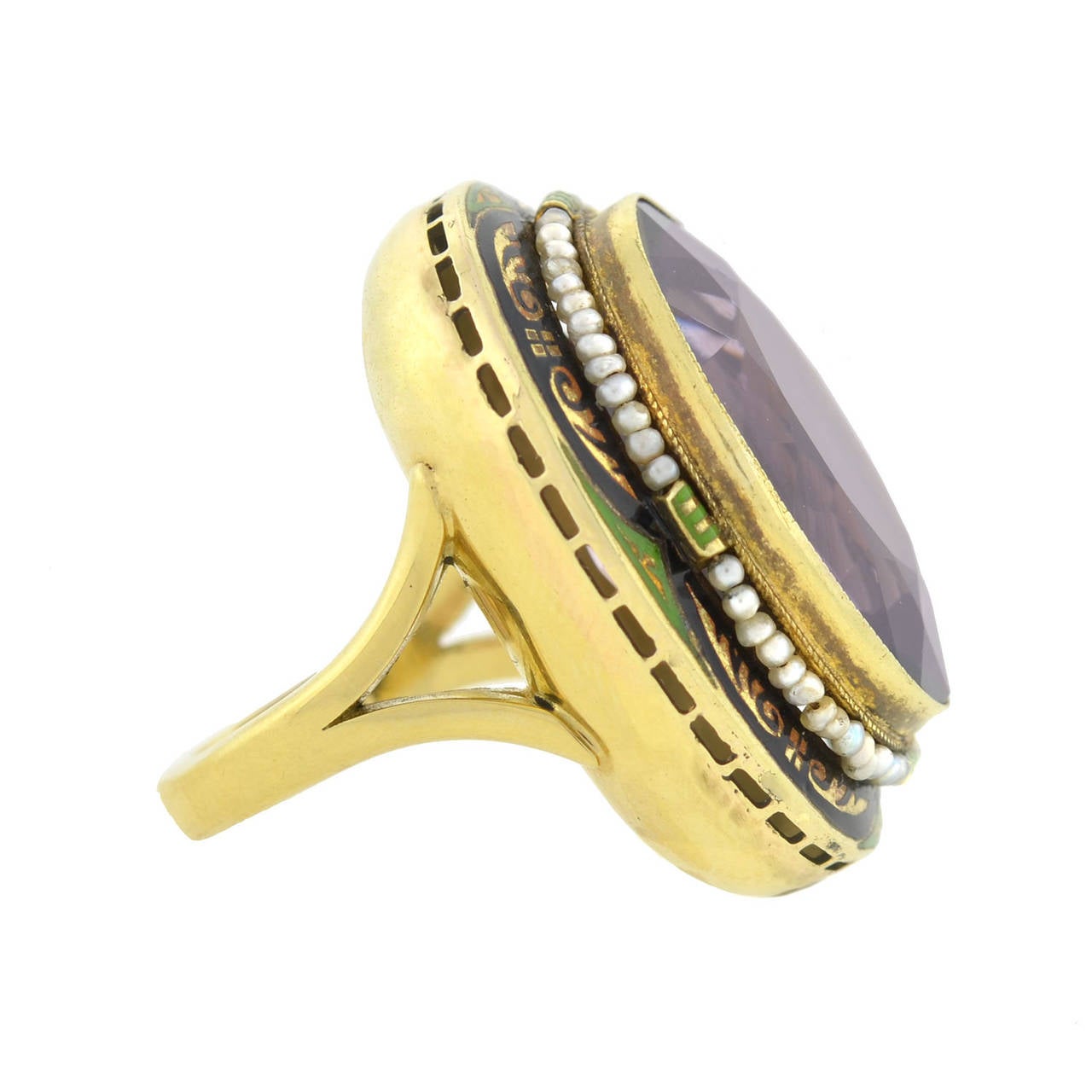 An exquisite amethyst ring from the Art Deco (ca1920) era! Made of 14kt yellow gold, this fabulous piece holds a large, faceted, oval shaped amethyst stone at its center. The bezel set stone has a faceted face and back and exhibits a vibrant, purple