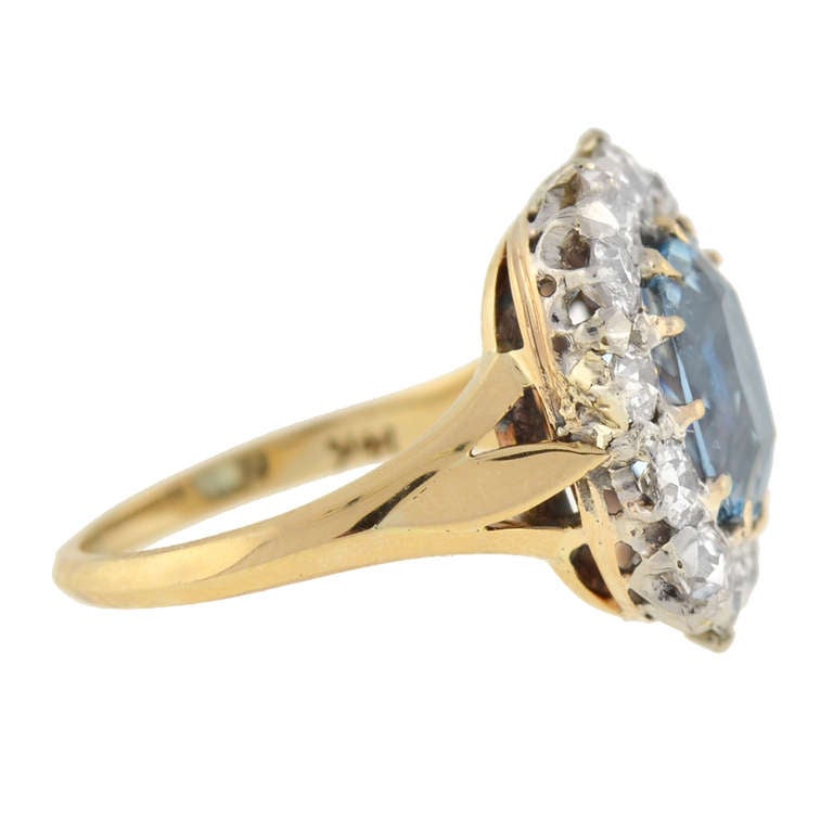An absolutely stunning aquamarine and diamond ring from the Edwardian (ca1900) era! The large center stone is an exquisite faceted 3ct aquamarine that is surrounded by 12 sparkling old Mine Cut diamonds. The diamonds weigh approximately 2.00ctw and