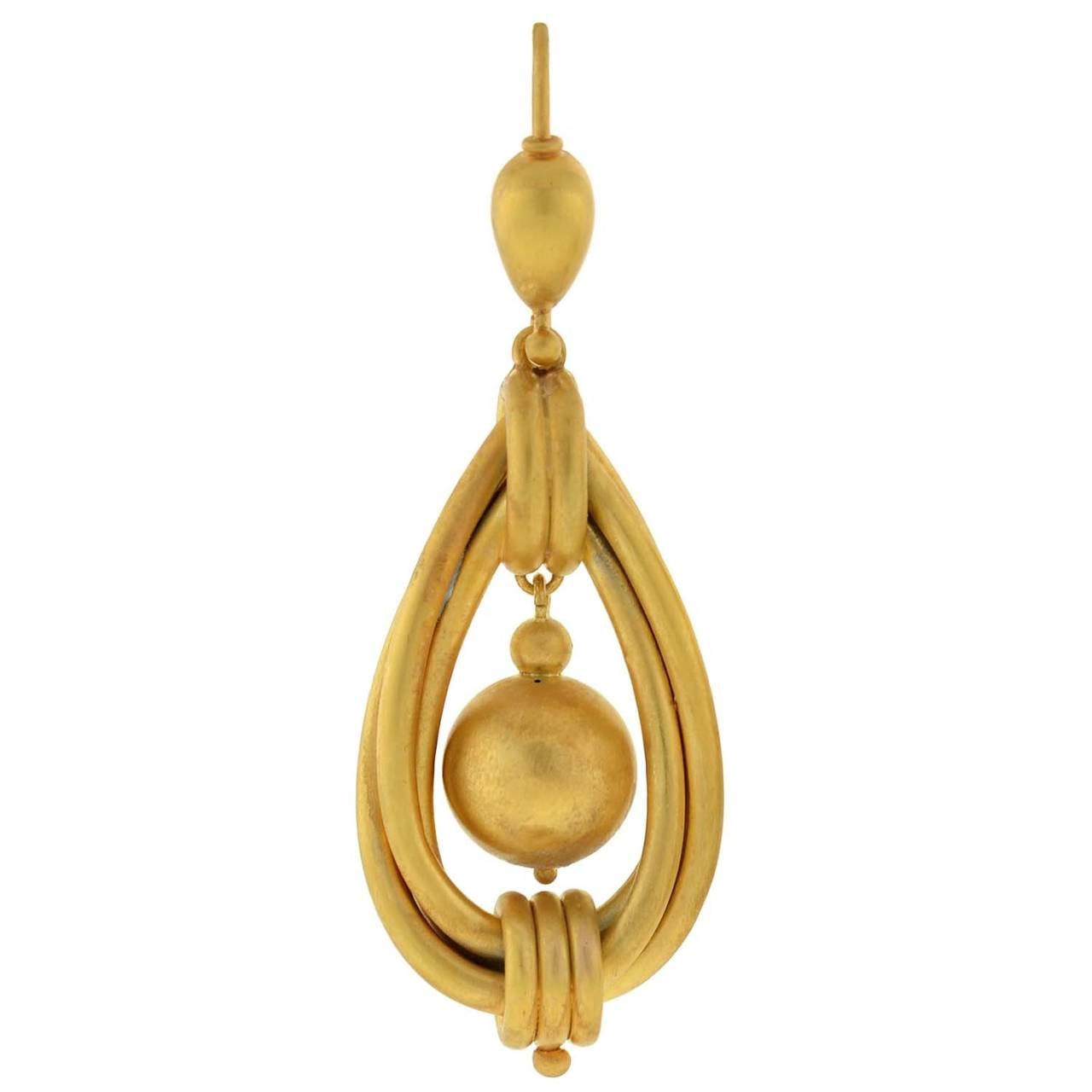 Absolutely fantastic gold earrings from the Victorian (ca1880) era! Each earring, which is particularly large in size, is made of vibrant 15kt yellow gold and is beautifully decorated with an unusual and lovely design. The earrings, which have a