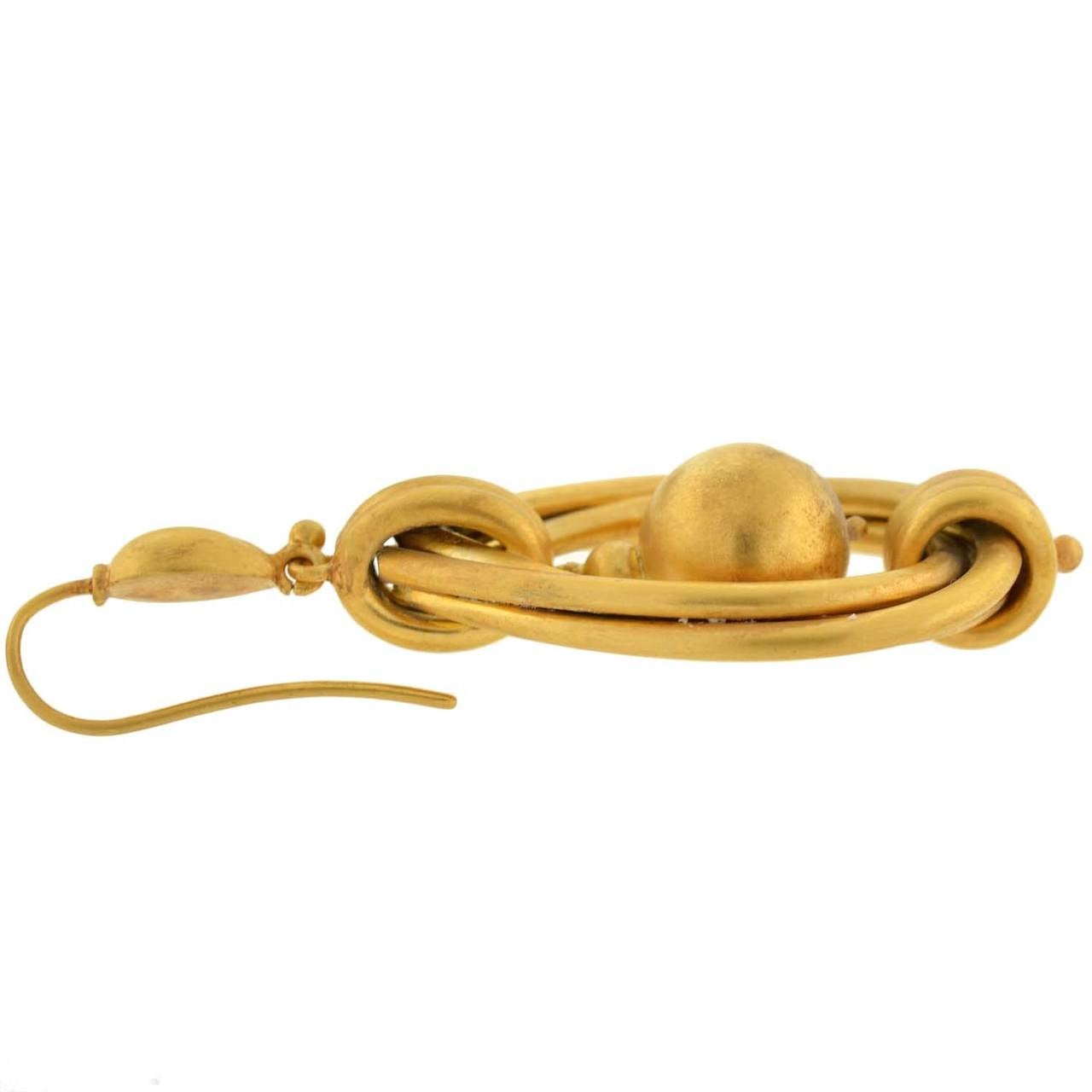 large gold hoop earrings with balls