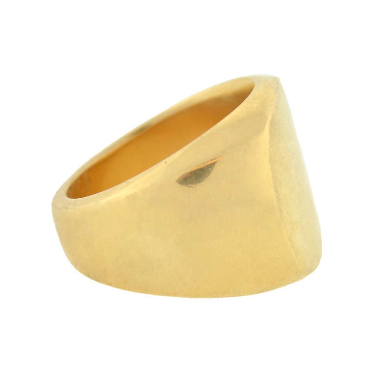 An absolutely fabulous heavy gold Estate ring signed by Church! Made of 14kt yellow gold, this large signet style ring has a bold, attractive look. At the center of the ring is a wide square-shaped seal with a smooth, flat surface. Each shoulder of