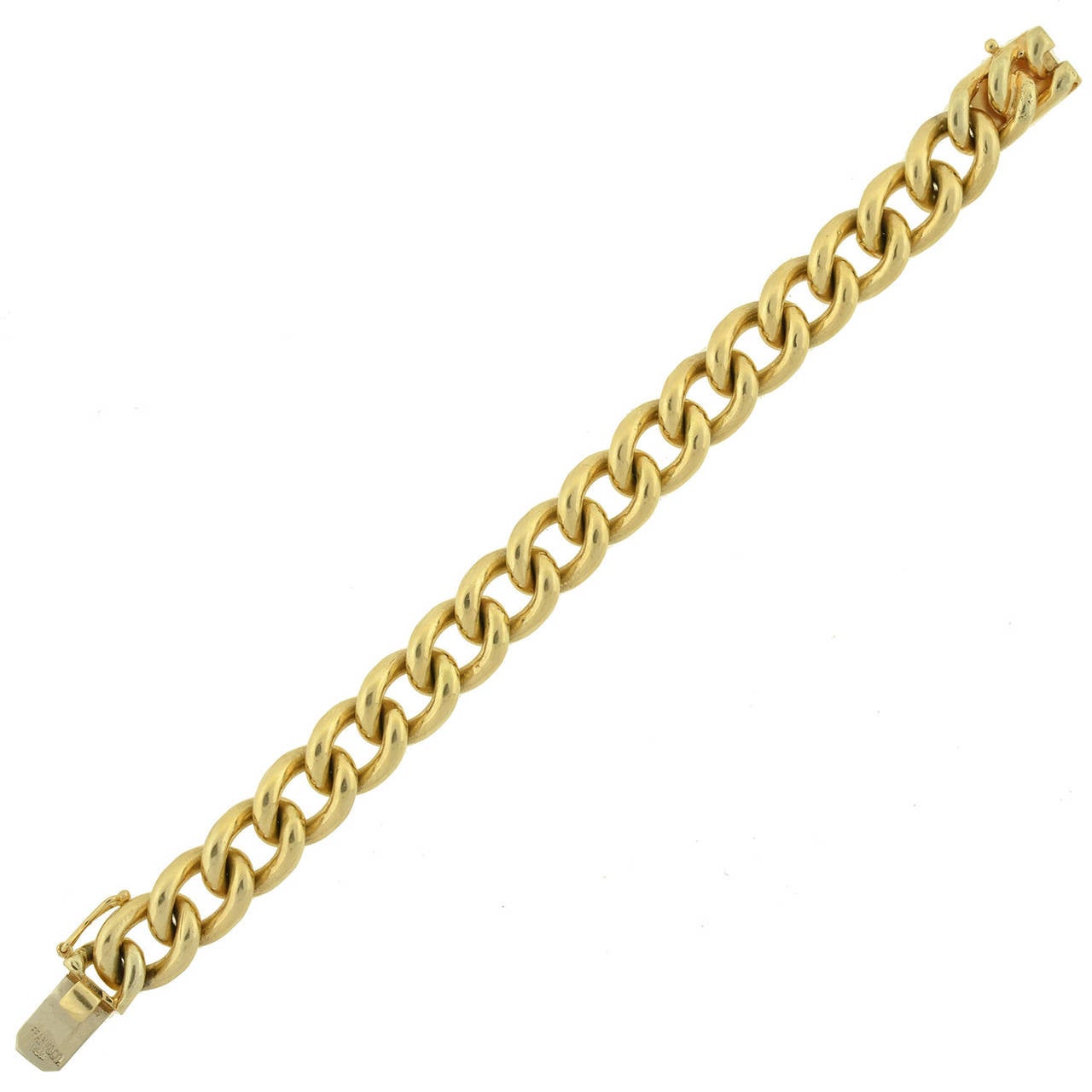 This fabulous gold bracelet is a signed estate piece by Tiffany & Co.! The 14kt gold bracelet is comprised of heavy Cuban links, forming a stylish gold chain that wraps around the wrist. Hidden within the links is a secure push clasp, stamped