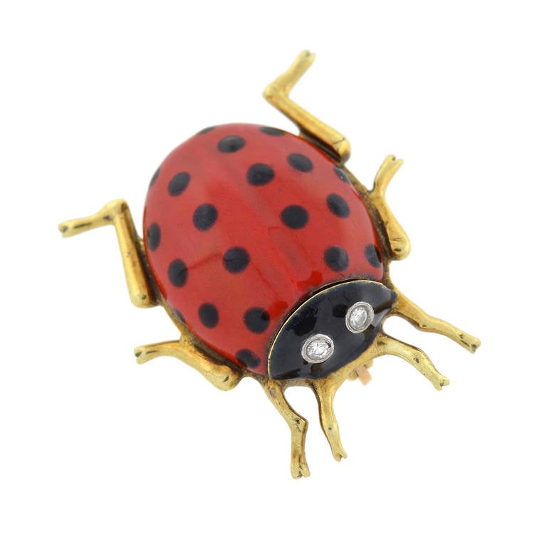 A simply wonderful pin by legendary maker Cartier! From the 1970's, this beautiful vintage piece is made of 14kt yellow gold and portrays a charming ladybug with a vibrant black and red enameled body. Six bent legs peek out from the underside of the