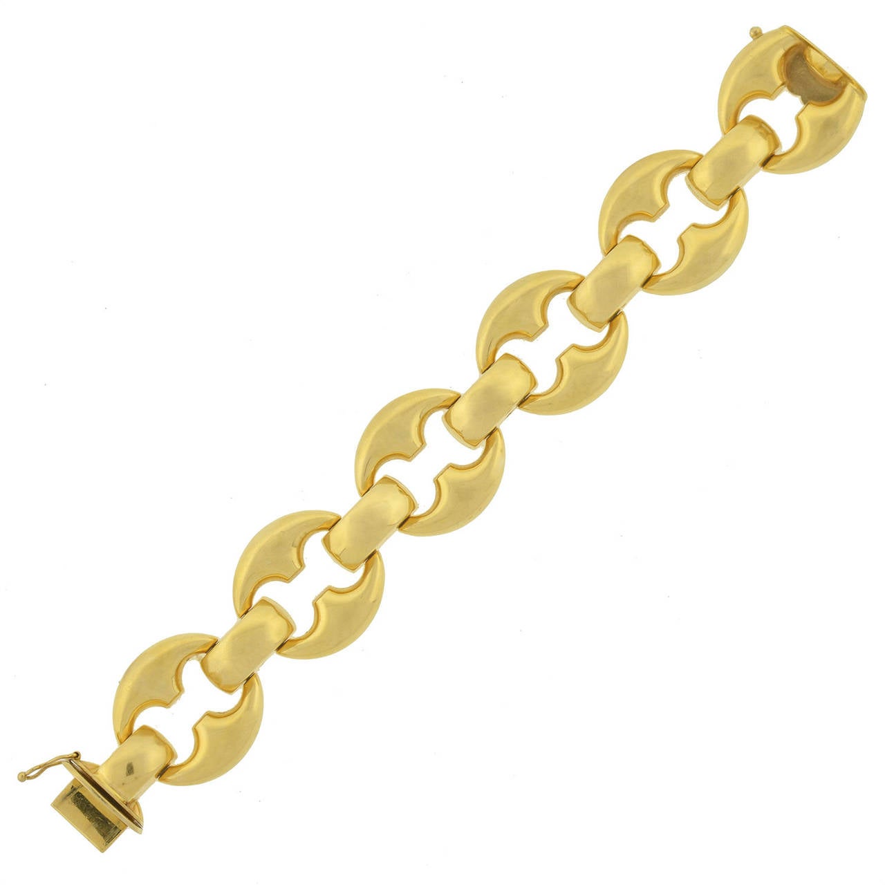 An absolutely fabulous Vintage gold link bracelet from the 1960's! This fashionable piece is made of vibrant 18kt yellow gold and comprised of large Gucci style links that alternate with complimentary gold connector links. The bracelet opens and
