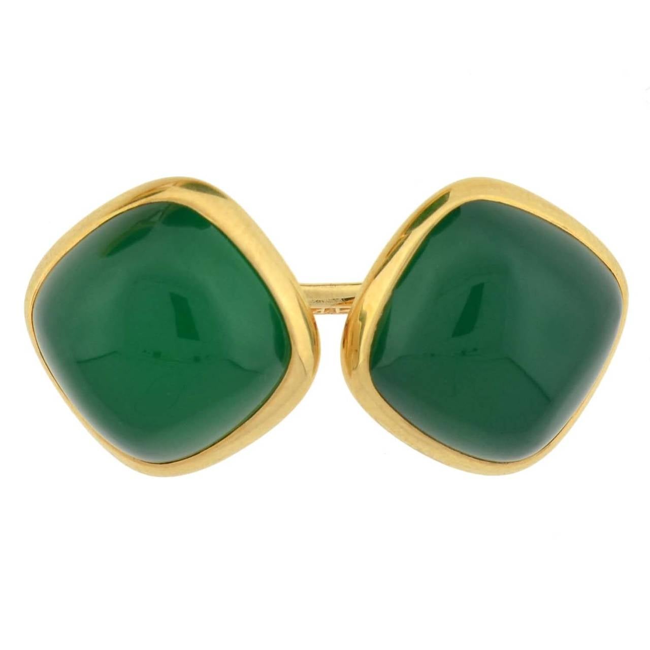 An exceptional pair of Larter & Sons cufflinks from the late Art Deco (ca1930's) era! Crafted in 14kt yellow gold, each of these double-sided cufflinks has a rounded square face with a vibrant chrysoprase stone set in the center. The luscious green