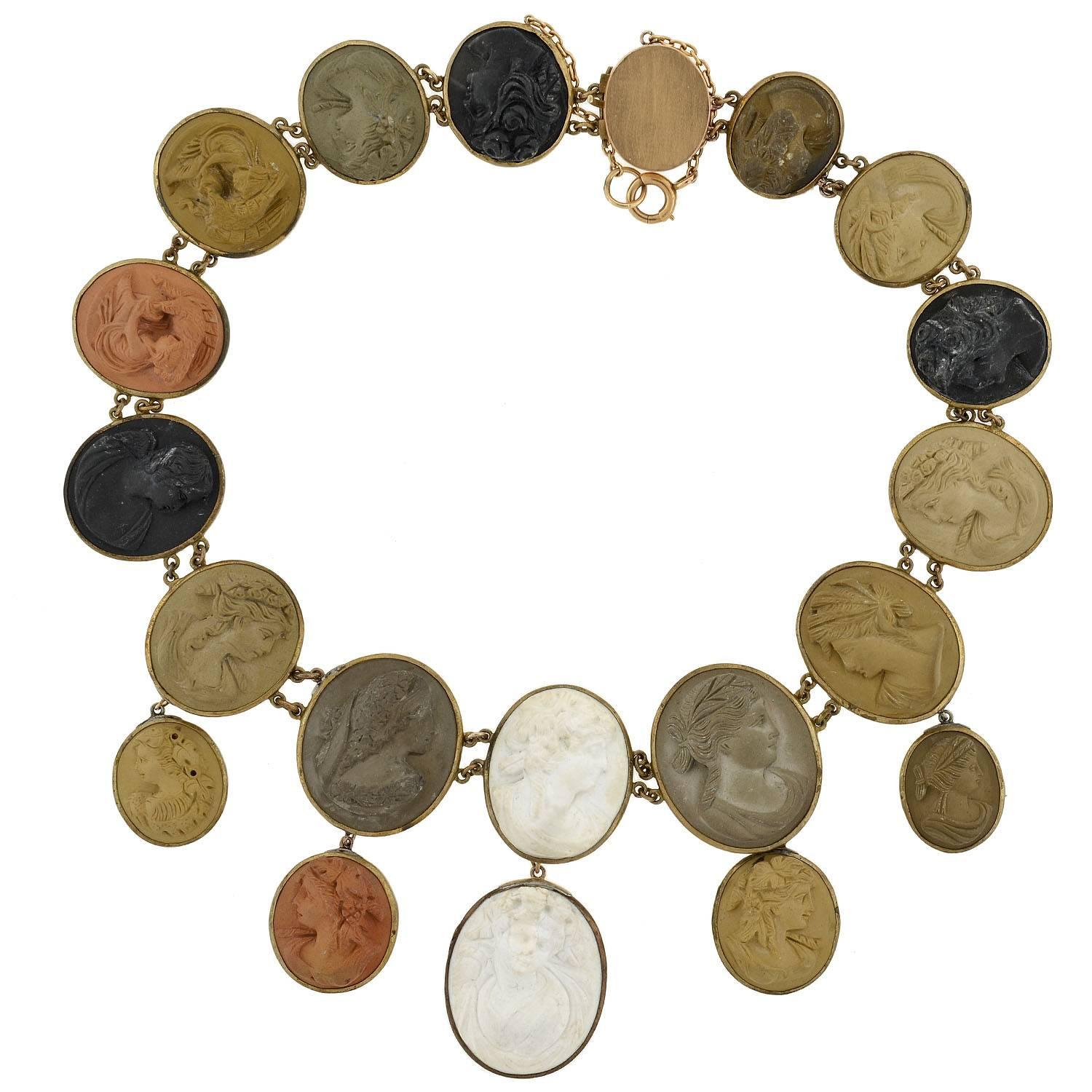 A simply exquisite lava cameo necklace from the Victorian (ca1880) era! This extravagant piece is comprised of 19 large cameos, all made from different colors of lava. The cameos graduate in size, getting larger towards the center and hanging from