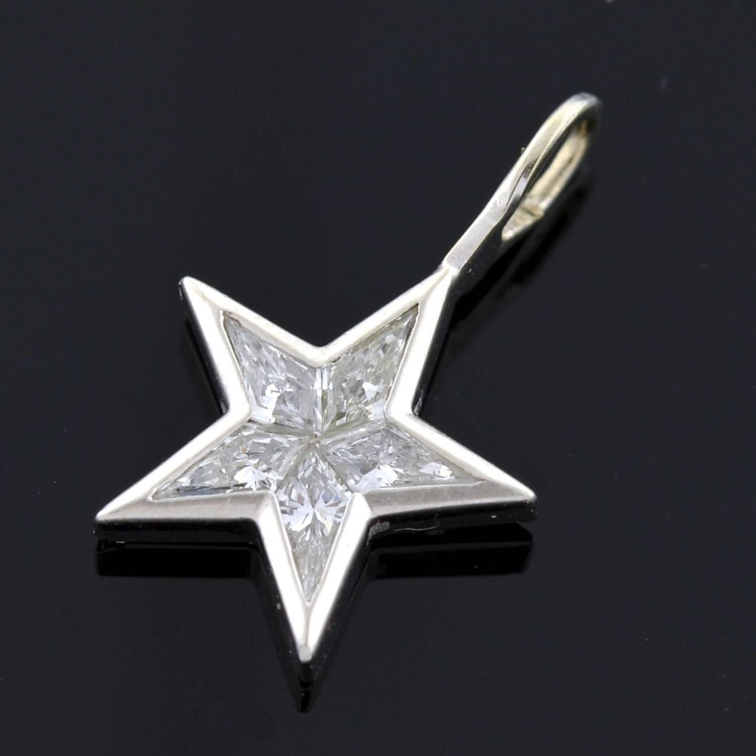 A beautiful Estate diamond star pendant! Made of platinum, this lovely piece is comprised of 5 Kite Cut diamonds, which fit together perfectly to form the shape of a 5-point star. The diamonds are invisibly set, giving the illusion that the star is