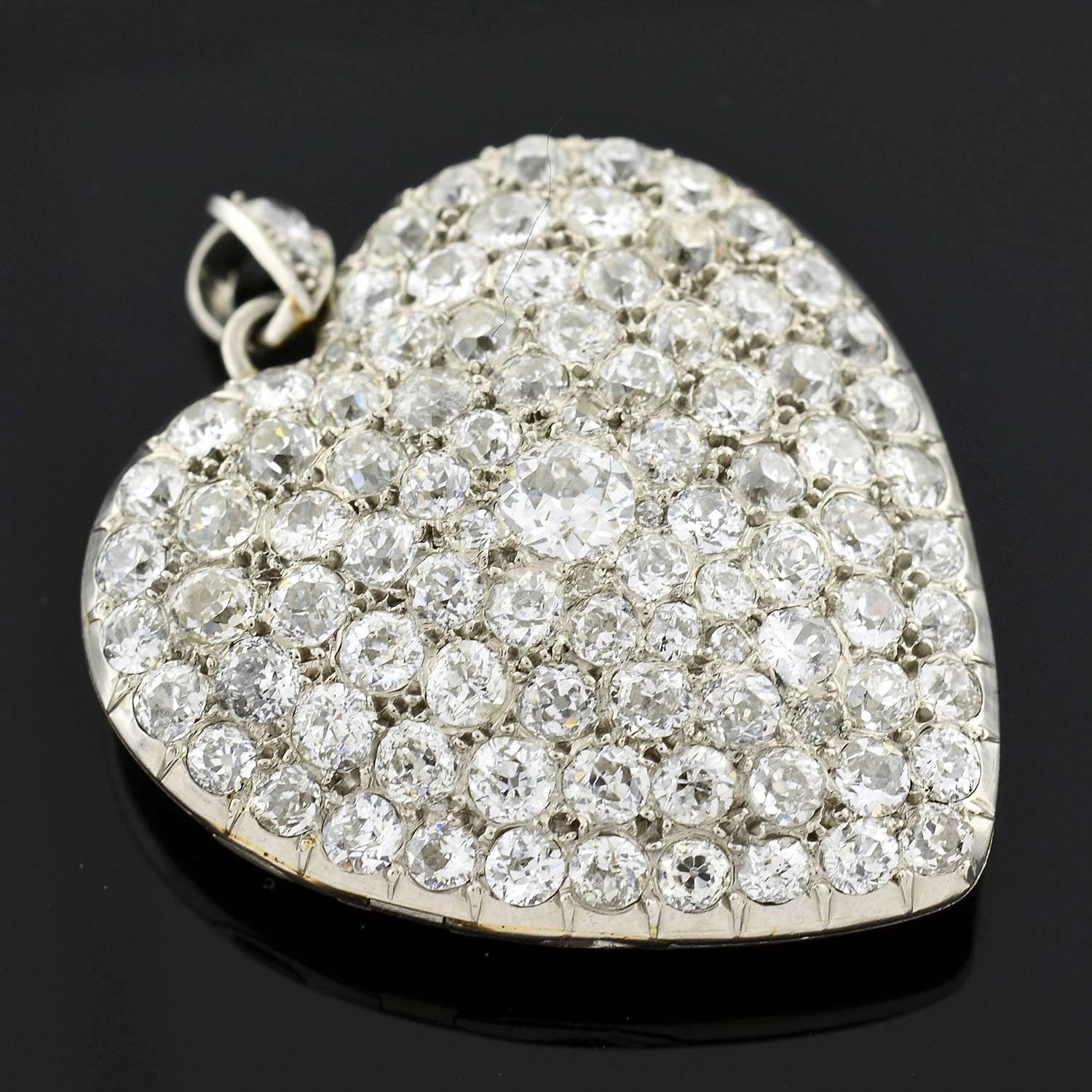 A simply breathtaking diamond heart locket from the Edwardian (ca1910) era! This exquisite piece is quite substantial in size and is crafted in platinum. The entire front surface of the heart is encrusted with sparkling pave set diamonds, which have