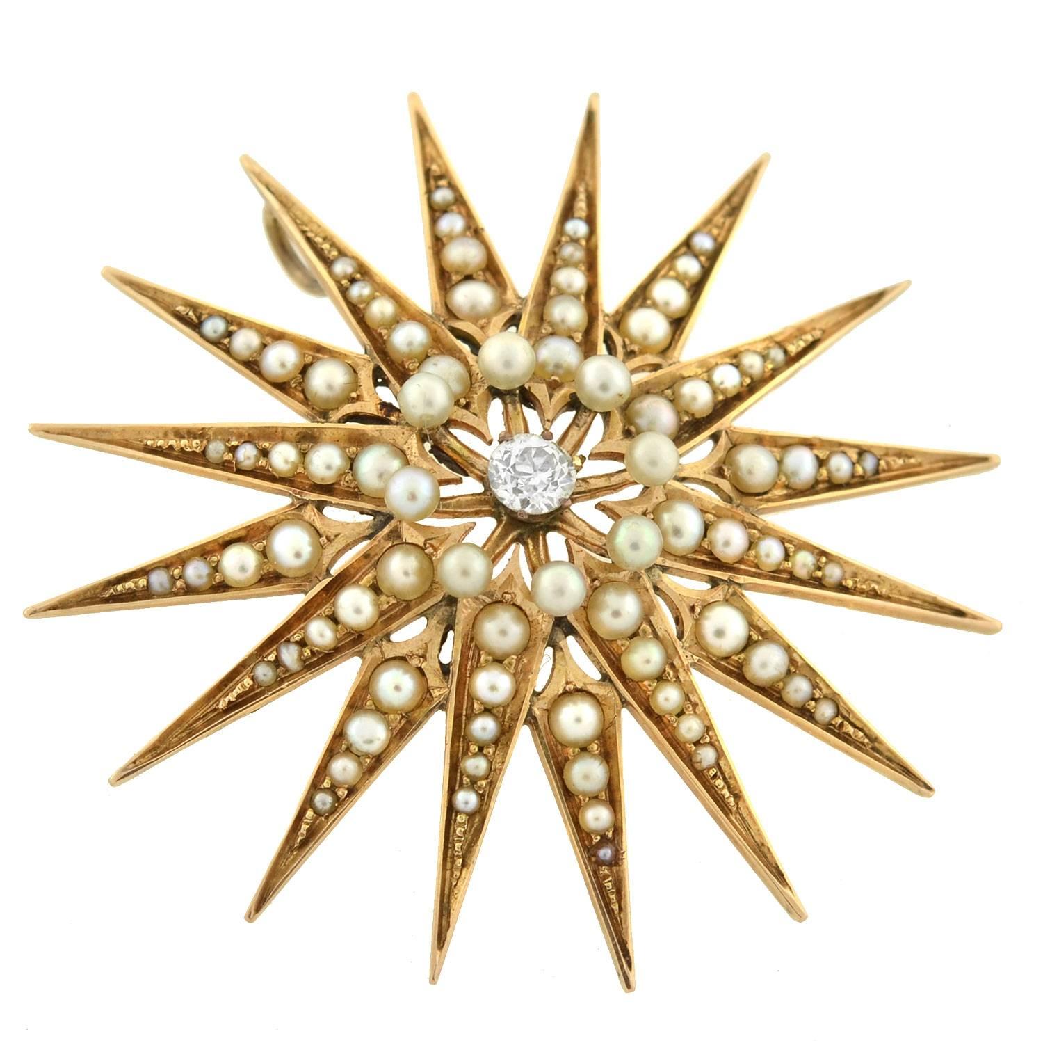 A simply stunning starburst pendant from the Victorian (ca1880) era! This gorgeous piece is crafted in 14kt yellow gold and has an impressive size and design. The beautiful 16-point starburst is lined with delicate natural pearls in a bead setting