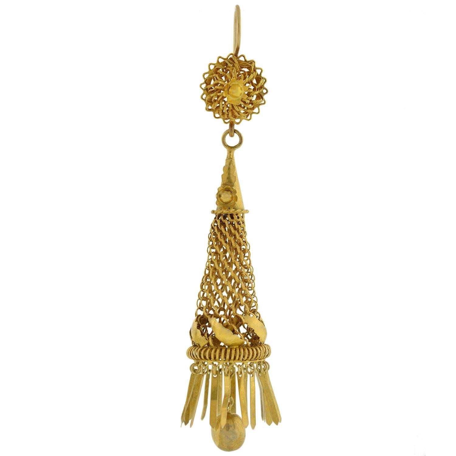 An incredible pair of rare hand wrought earrings from the Early Victorian (ca1850) era! These elaborate earrings are of English origin and are handcrafted in vibrant 15kt yellow gold. They have a intricate design that incorporates finely woven gold